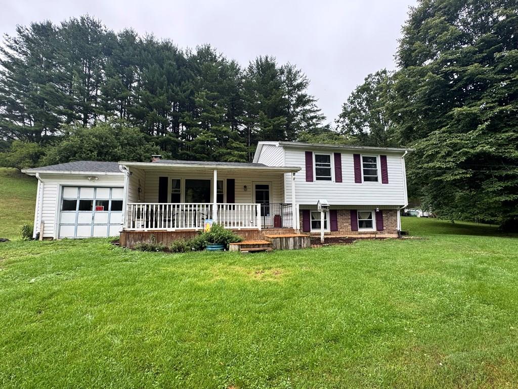 Home and 5 Acres in the Highlands. This 3 bedroom, 1 and 1/2 bath home is located in a very private setting close to the entrance to Grayson Highlands State Park. It features many upgrades including newer carpet, new paint throughout, and new doors and light fixtures as well as updated appliances.  The home also features an oil furnace, a covered porch, a 1 car garage, and a shed and outbuilding. The yard is very private with apple trees and mature landscaping. The acreage is mostly wooded and full of wildlife for birdwatching or deer hunting. Located in Western Grayson County, this property is in close proximity to all of the recreational opportunities in Jefferson National Forest, Grayson Highlands Park, the New River and the Virginia Creeper Trail. This property is also just minutes to the NC line and just a short drive to West Jefferson, NC.