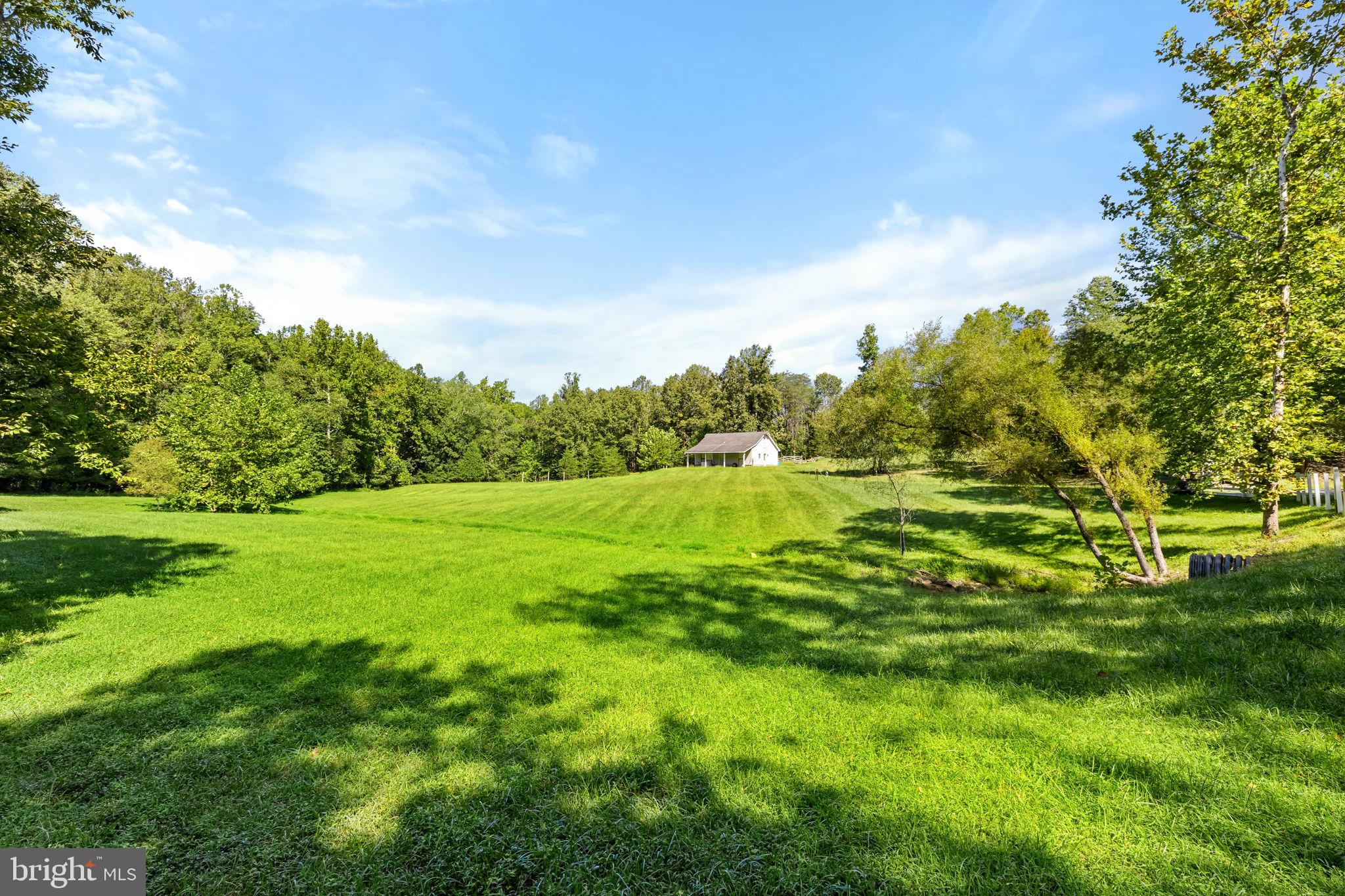 Imagine building your dream home on 26 private acres in Stafford County, surrounded by woods, nature, and plenty of room to create exactly the lifestyle you want. Keep all 26 acres for yourself, or take advantage of the opportunity to subdivide the property one time, with each parcel containing a minimum of 10 acres. Create a second homesite, sell a portion in the future, or simply choose who your neighbor will be. Whether your plans include gardens, animals, recreational space, or just having plenty of privacy around you, this property gives you the space and flexibility to make it your own. An existing barn is already in place, along with road access and a gravel driveway. Even better, some of the groundwork has already been completed, including previous soil testing with approval for a septic system (just needs to be renewed) and a well permit that was previously secured. Located within a private community featuring beautifully maintained riding and walking trails that wind through the woods and alongside natural streams, the setting offers a wonderful combination of privacy and recreation. Bring your builder, your plans, and your vision. Finding this much acreage in Stafford County with subdivision potential, existing improvements, and this level of privacy is something special!