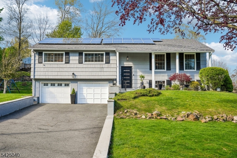 Direct golf course views, a flexible layout & meaningful updates this one truly stands apart ! Set on a prime corner lot across from Byrne Golf Course, this spacious 4 B/R, 3 full BA home showcases sweeping views of the rolling greens, creating a rare sense of openness & everyday tranquility. High ceilings & abundant natural light enhance the home's inviting feel. The living room features windows w/classic grid detail & crown molding. A formal dining room flows seamlessly into the sunroom & kitchen ideal for both everyday living & entertaining, while the sunroom offers a peaceful retreat where the views take center stage. The upd kitchen features high-quality cabinetry, granite countertops & a stylish tiled backsplash, along w/ s/s appl's, including a new refrigerator & dishwasher. Center island + large window w/ natural light & outdoor greenery. Beautifully updated baths reflect the same attention to detail. Flexible layout includes 2 ensuite B/R's spacious primary w/ updated BA + a ground-level B/R w/ its own full BA, ideal for guests, extended living or private workspace. Ground level also features a huge versatile family room (currently used for a home-based business) & laundry area. One bay of the 2-car garage is set up as a  dedicated exercise room. Solar panels add efficiency; roof approx. 10 yrs young. Additional improvements include newer windows throughout most of the home, updated lighting & interior doors. A rare blend of views, space & versatility don't miss it .