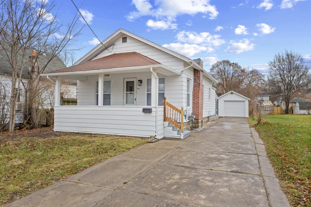 Welcome to this beautifully updated 2-bedroom bungalow in the heart of Lansing! Step inside to a bright and inviting living area featuring fresh paint, new flooring, and large windows that fill the home with natural light. The kitchen has been tastefully refreshed with crisp white cabinetry, updated countertops, and an efficient layout that flows seamlessly into the dining area. Both bedrooms are conveniently located on the main level, along with a modernized full bathroom. A charming sunroom provides additional flexible space--perfect for a home office, playroom, or cozy relaxation spot. The clean and spacious basement offers excellent storage, a second bathroom, and potential for future finishing. Outside, enjoy a generous fenced backyard, a covered patio ideal for outdoor living, and a detached garage. Nestled on a quiet street with easy access to schools, shopping, dining, and highways, this move-in-ready home is the perfect blend of comfort, convenience, and modern updates.