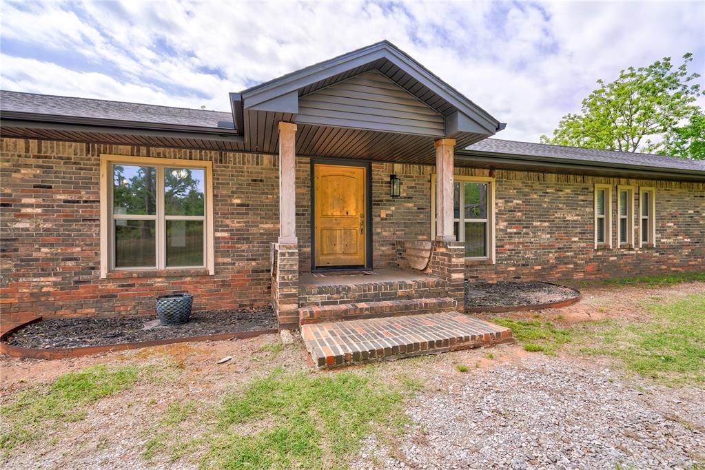 Welcome to your dream ranch-style home nestled on 10 acres of picturesque land, where every detail has been carefully considered in this newly remodeled masterpiece. The spacious 5 bedrooms and 3 bathrooms offer ample accommodation for family and guests, while the 2-car garage provides convenience and storage space. Step inside and discover a world of style and comfort. The large study with French doors offers a peaceful retreat for work or relaxation, while the open living room and kitchen concept creates an inviting space for gatherings. A large brick wood-burning fireplace with mantle adds warmth and charm, complemented by unique lighting fixtures throughout the home. The kitchen features granite countertops and island, chrome appliances including a double oven, and plenty of cabinet space for storage. A big wash basin sink and tiled backsplash with under-counter lighting adds both style and functionality. The master bedroom is a sanctuary unto itself, boasting large closet space and a luxurious bathroom with his and her sinks, a tiled step-in shower with a brushed bronze sprayer, and extra cabinetry for utilities and linens. Granite countertops grace all bathrooms, adding a touch of sophistication. Additional features such as a big laundry room with mud area, granite sink, and cabinetry, as well as an internal vacuum system, enhance the convenience and functionality of this remarkable home. With OEC fiber internet and zoned A/C throughout the house, you'll enjoy modern amenities seamlessly integrated into the charm of ranch living. Outside, a large storm cellar provides peace of mind, while a barn/workshop with private entry and gate offers endless possibilities. Livestock pens and fenced acreage at the back of the home cater to your ranching needs. This is more than a home; it's a lifestyle. Come experience the tranquility of ranch living. .