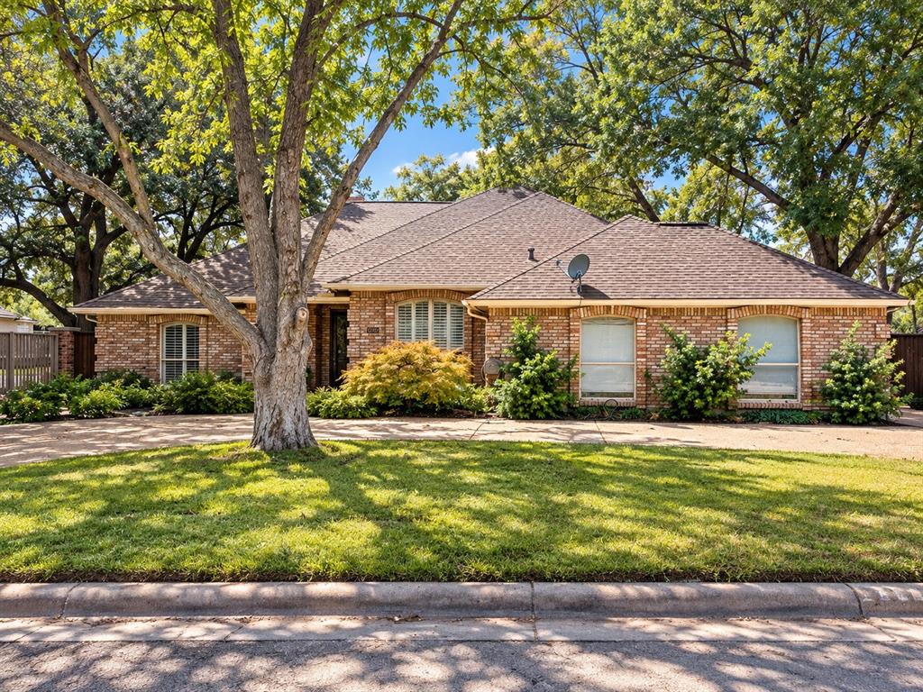 Nestled on an exceptional corner lot in highly sought-after Ridglea Country Club Estates, this charming home offers a rare combination of an incredible location and a private backyard retreat. Tall fencing creates a secluded oasis where the backyard is divided into two distinct spaces: a sparkling pool and spa on one side, and an oversized screened sunroom with a beautiful flower garden and sitting area on the other. It’s the kind of outdoor space made for morning coffee, afternoon swims, and evenings spent lingering with friends.The kitchen features beautiful quartz countertops, abundant tall wood cabinetry, and plenty of workspace for everyday living and entertaining. The spacious living area centers around a fireplace and includes a built-in bar, a classic feature making a major comeback and perfectly suited for entertaining. A dedicated dining area plus a separate breakfast nook give you plenty of options for casual meals or larger gatherings.Brand-new carpet adds a fresh feel throughout the living spaces, while the home's established charm and mature landscaping give it a warmth that's hard to recreate.And then there’s the location. Ridglea Country Club Estates puts you close to some of Fort Worth’s most desirable shopping, dining, recreation, and neighborhood amenities, while this particular corner lot feels remarkably private once you’re home.A true Fort Worth gem with an unbeatable setting, a backyard retreat, and the kind of location that simply doesn’t come along often.