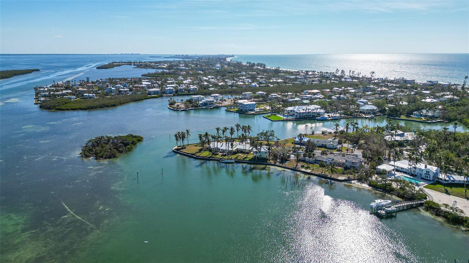A Rare Opportunity to Own an Exquisite Bayfront Property on Longboat Key!Discover an extraordinary chance to build the waterfront estate of your dreams on this sprawling estate-sized property located in the exclusive enclave of Bayou Hammock. Boasting an impressive 200 feet of direct bayfront access, this prime location offers unobstructed, forever views across the bay to the Intracoastal Waterway.Immerse yourself in the natural beauty of the surroundings, where panoramic vistas of sparkling water are complemented by the serene sights and sounds of graceful seabirds, playful sea life, and gentle bay breezes. This private, secluded setting provides a rare blend of tranquility and prestige, making it the perfect canvas for a magnificent custom estate.Whether you envision a grand waterfront mansion, lush tropical landscaping, or a private dock to fully embrace the boating lifestyle, this property offers endless possibilities. Don't miss this once-in-a-lifetime opportunity to secure one of Longboat Key’s most coveted bayfront addresses.For those who value privacy, elegance, and breathtaking waterfront views, this property represents an unparalleled offering. Walking distance to the beach and many fine restaurants and shopping.