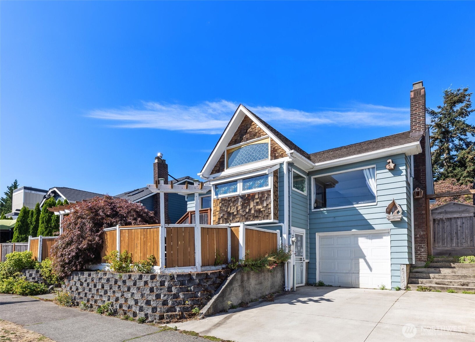 Charming Craftsman Bungalow in a Prime “Stumbletown” LocationAmazing, move-in-ready Craftsman bungalow in the highly convenient “Stumbletown” neighborhood, perfectly positioned between Ballard and Phinney Ridge. Full of character and thoughtful custom touches, this inviting home features beautiful oak hardwood floors with intricate wood inlay, distinctive box-beam ceilings in the dining room, and an abundance of large windows that fill the space with natural light.A fantastic alternative to townhouse living, the home offers a private, fully fenced setting with low-maintenance front and back patios—perfect for relaxing, entertaining, or enjoying a little outdoor space without the upkeep.The flexible zoning allows for commercial, home-business, or development use, adding valuable versatility and future potential. Recent updates include plumbing and electrical wiring, plus efficient mini-split cooling for year-round comfort.The main level features two bedrooms and one bath, while the spacious basement offers even more possibilities, including a second bathroom already framed in and ready for future completion. Whether you’re looking for a charming place to call home, a live/work opportunity, or a property with long-term development potential, this special bungalow delivers.