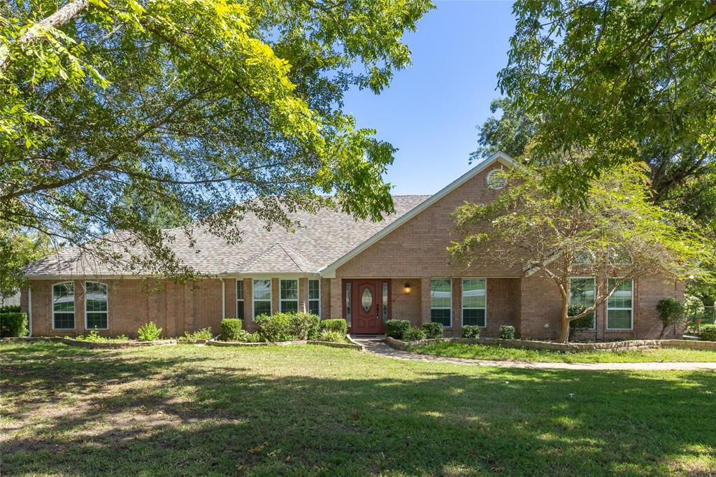 A delightful, custom brick 3bed-3.5bath home sits on 1.625 acres within the city limits with in-ground swimming pool! Bring your family and friends with room for entertaining inside the spacious interior with over 3,200 square feet. Two living areas and two dining areas provide plenty of seating options for the whole family. Formal dining room & breakfast room with built-in bookcase. The open kitchen and living areas easily flow into the backyard oasis. Custom built-ins in guest bedrooms provide extra storage. Sit on the back patio or swim in the pool, with diving board, during the dog days of summer. Established Pecan trees and Live oaks add shade and value to the outdoor space. With a remodel completed in 2019, you can move in and start enjoying this home right away. A little touch of the country while being in the city!