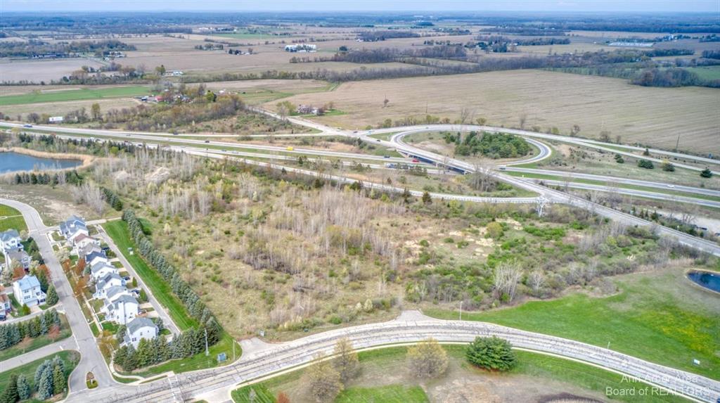 18.53 acre parcel located adjacent to Milan's Dexter St business corridor.  One of the last remaining parcels available for commercial business opportunities on Milan's busy Dexter Street, with visibility from US 23.  Hotel, restaurant, strip mall, office building or all of the above mentioned uses are perfect for this incredible land.  Location is everything.  Zoned PUD, this land can entertain all of these options.  Roughly 4 acres are already reserved as retention pond/storm water management area which are required for commercial use applications.  This is Milan's last remaining significant commercial land along US 23 and the Dexter Street corridor.  Seller is willing to sell all at once or divide up for the end user.  Owner is a licensed agent in the State of Michigan.