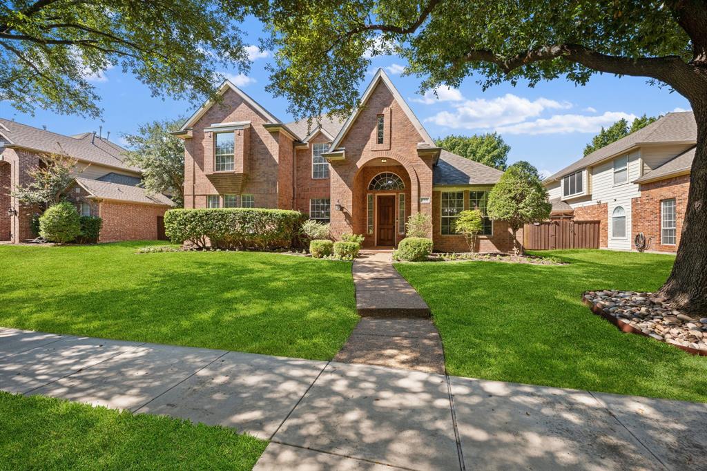 This captivating 5 bedroom, 4 bath home is nestled in a tree-lined cul-de-sac within the highly desirable Russell Creek community, offering an idyllic blend of space, comfort, and luxurious living. Step inside to find soaring ceilings, elegant wood floors, and a curved staircase in the entry. The stacked formal living and dining areas create a welcoming space that is perfect for hosting gatherings. The open-concept layout seamlessly blends the breakfast area with the family room and kitchen, making it easy for everyone to be together, whether cooking, dining or relaxing. The inviting family room provides an abundance of natural light, while a cozy gas fireplace serves as the perfect focal point for family gatherings. The beautifully updated kitchen is a chef's delight, that is ideal for casual dining as well as hosting dinner parties. The kitchen boasts quartz countertops, crisp white cabinets, a gas cooktop, double ovens, and a walk-in pantry. The downstairs primary suite provides a tranquil escape with its ensuite bath boasting dual vanities, a spacious shower and a relaxing garden tub. A second bedroom downstairs accommodates multigenerational living needs and is currently being used as a home office. Upstairs, three more bedrooms, two Jack-and-Jill bathrooms, a media room with sound control, and a loft area offer ample space for relaxation and recreation. The backyard patio is perfect for summer cookouts and the yard offers plenty of space for play, safely enclosed by an electric driveway gate. Residents enjoy exceptional neighborhood amenities, including pools, sports courts, parks and it is in close proximity to Russell Creek Park with its soccer fields, basketball courts and playgrounds. Conveniently located near plenty of great retail, dining and entertainment with easy access to major highways. Zoned to Plano ISD schools. This beautifully maintained home is a rare find, offering unmatched comfort, a prime location, and the promise of cherished memories.