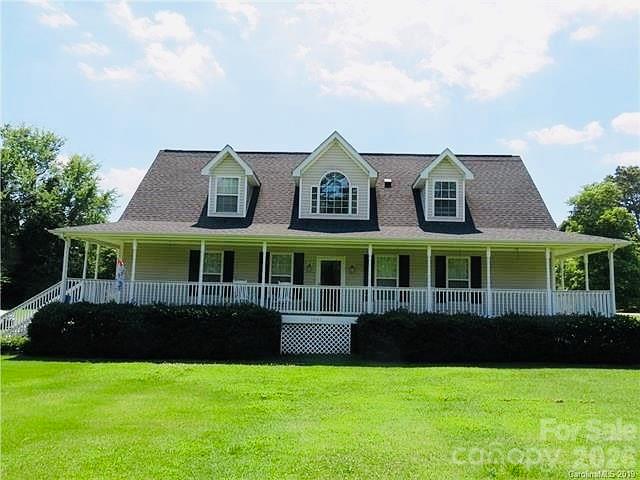 Welcome home to this charming Cape Cod-style residence in popular Dallas, NC! Offering 4 bedrooms, 3 full bathrooms, and over 2,500 square feet of living space, this home provides plenty of room for comfortable living and entertaining. Situated on nearly 3/4 of an acre, the property features a partially fenced yard with ample outdoor space. A covered wrap-around front porch adds classic curb appeal and creates the perfect spot to relax and enjoy the surroundings. With its desirable location, spacious lot, and timeless Cape Cod style, this home is ready to welcome its next owners!