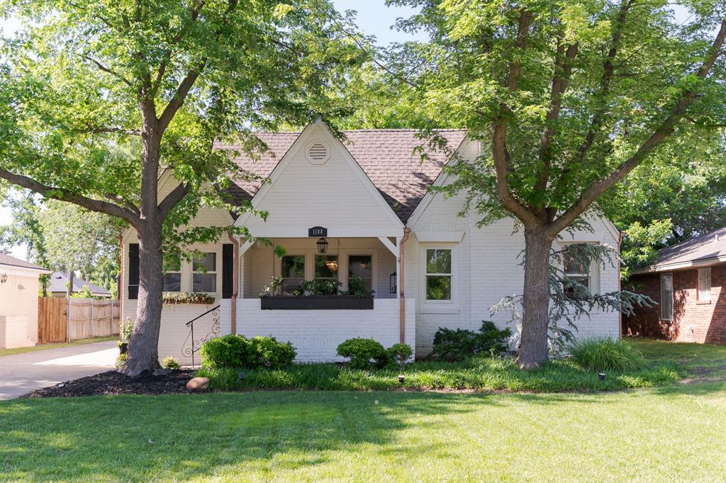 Step into a little piece of 1928 magic. This storybook Tudor feels like something pulled straight from a movie — timeless black-and-white exterior, charming architectural details, classic checkerboard tile, and the kind of natural light that makes every room feel warm and inviting. The picturesque front porch framed by mature trees and adorned with hanging pots overflowing with pink roses creates an inviting first impression. Inside, you’ll find 2 bedrooms, 1 bath, and a home filled with character you simply can’t recreate. From the vintage charm to the cozy, curated feel, every space feels intentional, welcoming, and full of personality. Step outside to a private backyard retreat complete with a stone patio, mature trees, and plenty of room for hosting unforgettable evenings outdoors. Homes like this are rare — rich in charm, effortlessly stylish, and impossible not to fall in love with. Whether you’re drawn to historic architecture, natural light, or the feeling of a home with true soul, this Tudor is one you’ll remember long after you leave.