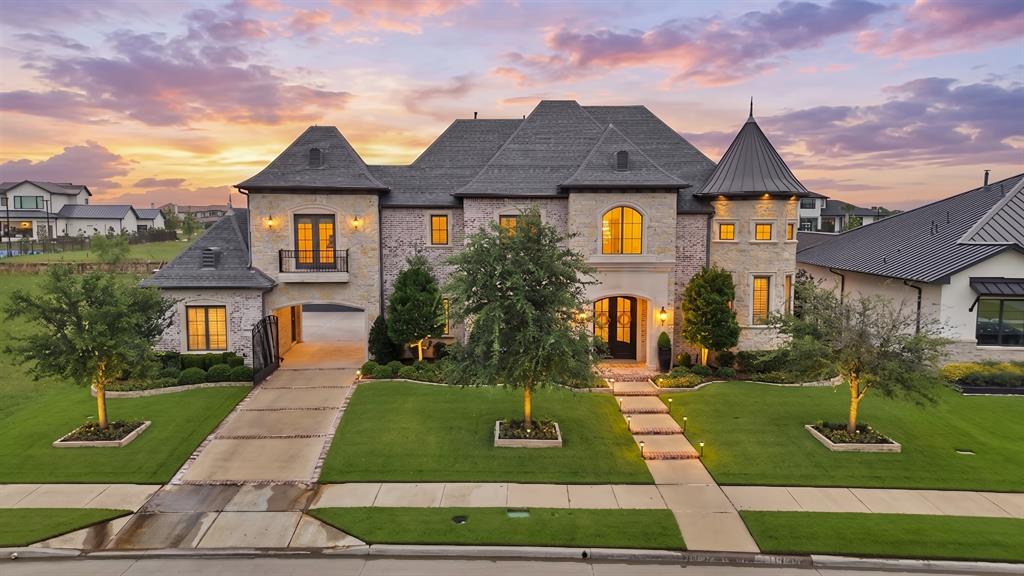 Located within the prestigious gated community, The Hills of Kingswood, this extraordinary five bedrooms, seven baths estate redefines modern luxury through impeccable craftsmanship, grand scale entertaining spaces, and a resort caliber outdoor retreat. Every detail of this remarkable residence has been thoughtfully curated to deliver an elevated lifestyle marked by sophistication, privacy, and timeless elegance.From the moment you enter, the home makes an unforgettable impression with soaring ceilings, designer lighting, and expansive walls of glass windows that flood the interiors with  natural light. The grand living room serves as the centerpiece of the home, offering a stunning blend of warmth with its statement fireplace, expansive open layout, and seamless connection to outdoor living spaces. Each of the five oversized bedrooms serve as a private retreat complete with ensuite bathrooms and custom walk in closets, delivering unparalleled comfort and privacy. The luxurious primary suite offers a tranquil escape with a large boutique style closet, soaking tub, and an oversized spa inspired steam shower.The resort inspired backyard is truly spectacular. Anchored by a stunning custom pool with dramatic water features, ambient lighting, and expansive sun lounges. Multiple entertaining spaces are surrounded by lush manicured landscaping. The covered patio serves as a seamless extension of the home and features a fully equipped outdoor kitchen also included automated shutters, heaters, and mosquito mist system allowing for a spacious gathering area designed for elevated entertaining to enjoy all year-round.For the automotive enthusiast, the impressive four car garage is elevated with two premium vehicle lifts accommodating up to six covered vehicles. Complete with showroom quality epoxy floors, custom lighting, and ample space for collectibles or recreational vehicles, the garage doubles as the ultimate luxury showroom and entertainment space.