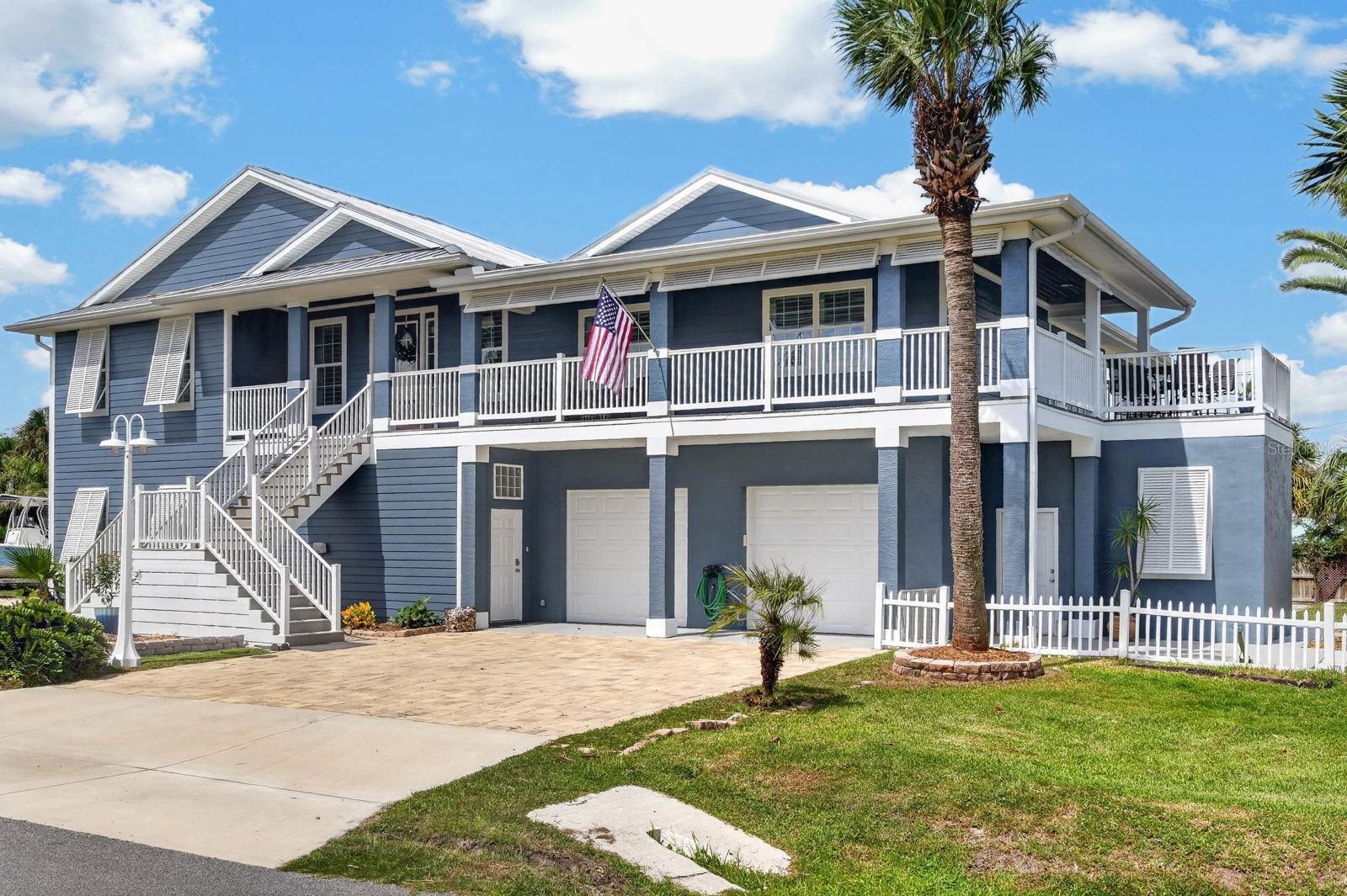 Welcome to 45 Rollins Drive, a truly one-of-a-kind beachside retreat offering exceptional space, flexibility, and coastal living. Situated on a double lot, this immaculate 4-bedroom, 4.5-bath residence features three private bedroom suites, each with its own full bath, plus a separate office ideal for working from home or creating a private study.Designed for both everyday living and entertaining, the home offers a spacious eat-in kitchen, two fireplaces, and a private home elevator providing convenient access between levels. Upstairs, a full wraparound deck creates an inviting setting for morning coffee, coastal breezes, entertaining, and beautiful Atlantic sunrise skies.One of the property's most impressive features is its extraordinary 2,234 square feet of total garage space. Two separate garages include a two-car garage and an oversized garage capable of accommodating up to six additional vehicles. Approximately 1,524 square feet of the six-car garage is air-conditioned, creating tremendous flexibility beyond vehicle storage. Use it for collector cars, motorcycles, recreational toys, a workshop, hobby area, fitness space, game room, or additional entertainment space. A separate golf cart garage adds even more storage and convenience.Step outside to your own private oasis featuring a heated salt-system swimming pool surrounded by generous outdoor living space—the perfect setting for relaxing, entertaining, and enjoying the Florida lifestyle.The beachside lifestyle continues with access to the community's oceanfront park, putting the Atlantic Ocean just moments from home. Conveniently located between historic St. Augustine and Daytona Beach, the property offers easy access to dining, shopping, entertainment, recreation, and some of Northeast Florida's most desirable coastal destinations.Meticulously maintained and enhanced with numerous recent updates and upgrades, 45 Rollins Drive offers a rare combination of a double-lot setting, exceptional garage capacity, private pool, flexible living spaces, and beachside location. This is far more than an ordinary coastal home—it's a distinctive Florida retreat offering the space to live, entertain, store, create, and enjoy everything the beachside lifestyle has to offer.