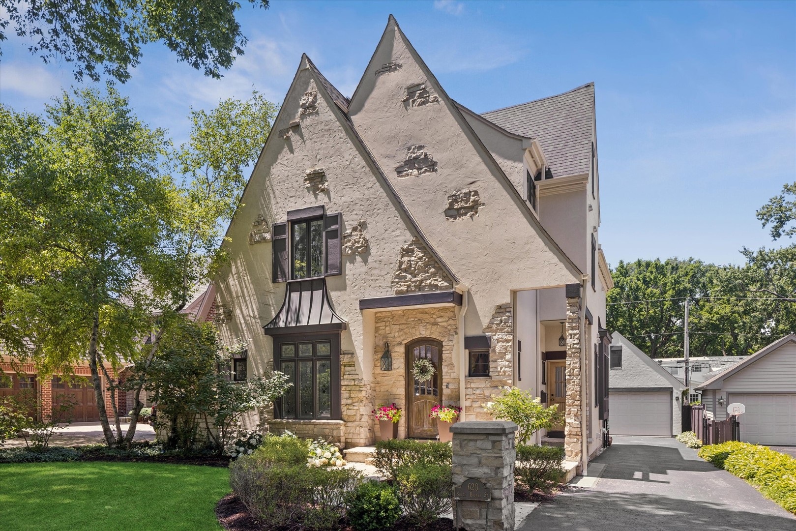 With its storybook architecture, picturesque landscaping, and timeless curb appeal, 620 S. Bruner is the kind of home that quietly captures your attention. Set along one of Hinsdale's most cherished streets, it evokes the warmth and character of a classic neighborhood where tree-lined sidewalks, front porches, and friendly waves are simply part of daily life.    Inside, gracious living spaces unfold with an effortless sense of comfort. Sunlight fills the home, creating inviting rooms that are equally suited for lively celebrations and quiet evenings at home. The heart of the home is a spacious kitchen with breakfast nook that opens naturally to the family room, while formal living and dining rooms provide timeless spaces for gathering.     The second floor includes a spacious primary suite with a cozy fireplace, two additional bedrooms with a hall bath and a convenient second floor laundry room.  The third floor includes a 4th bedroom suite or office space along with plenty of storage.  The lower level allows for a 5th bedroom space adjacent to a spacious rec room and a full bath.  There is also fantastic storage and an additional laundry room.  Outside, the private backyard feels like a natural extension of the home-offering generous patio space, mature landscaping, and room to relax, entertain, and enjoy every season.  Perhaps the greatest luxury is the lifestyle that accompanies this address. Just blocks from downtown Hinsdale, the Metra, award-winning schools, parks, and beloved neighborhood destinations, 620 S. Bruner offers the rare opportunity to enjoy the very best of village living while coming home each day to a residence that feels both timeless and deeply welcoming.  There is an authenticity to this home that cannot be replicated. It isn't defined by trends or fleeting design moments, but by enduring character, exceptional livability, and the unmistakable charm that has long made Bruner Street one of Hinsdale's most admired streets.