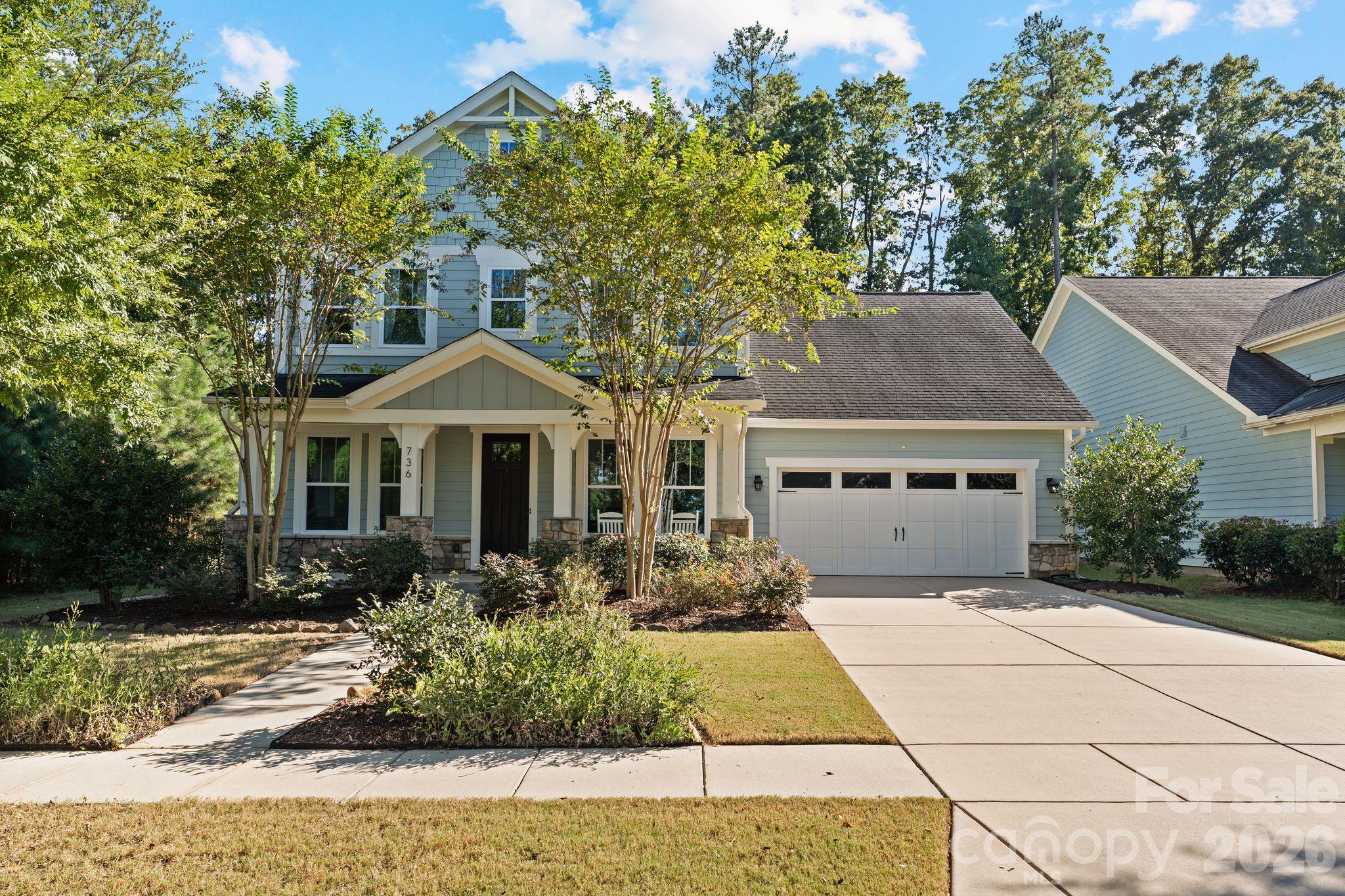 Welcome home to this beautifully appointed 4-bedroom, 3.5-bath. Tucked away near the end of the road, dead-end, adding an extra level of privacy in the sought-after Paddlers Cove! with a fenced backyard and beautiful wooded backdrop, this home offers an inviting blend of thoughtful design, flexible living spaces, and exceptional indoor-outdoor living.At the heart of the home, the spacious kitchen features an oversized island, quartz countertops, custom backsplash, under-cabinet lighting, elevated kitchen cabinetry, soffit cabinetry running to the ceiling that is lit with glass-front display, and statement hood range—perfect for everyday living and entertaining. Hardwood flooring flows throughout, while the glass-enclosed sunroom with a gas fireplace creates a cozy year-round retreat overlooking the backyard.Favorite features are the two indoor fireplaces and the renovated four-seasons sunroom that has glass windows with built-in convertible screened windows for year-round enjoyment!Step outside to an impressive FENCED IN outdoor living space featuring an expansive paver patio, built-in grilling station and kitchen, built-in fire pit with surrounding seating, mature landscaping, and garden space, all surrounded by beautiful wooded views. You will also see a rainwater collection system to the left side of the home for watering plants, garden, or whatever the new owners resourcefully use it for.The main level also features a private secondary suite, offering wonderful flexibility for guests or additional living space, along with a spacious mudroom, drop-zone, custom two-person home office, and half bath. The primary suite upstairs features a tray ceiling, beautifully appointed bath and shower with oversized walk-in closet. *ADDITIONAL BONUS FEATURES include: a tankless water heater, GENERAC generator, paid off solar panels that help lower the utility bills and that feed the generator for backup power during outages, two-car garage, sunroom, 2 fireplaces and one fire pit, motorized awning off the back sunroom that covers the paver patio, and an inviting covered front porch.Enjoy Paddlers Cove highlights including: its zoning for Lake Wylie High School, community center, pool, walking trails, and lake access for launching canoes and kayaks, along with nearby York County Field Day Park amenities where most local games and sports tournaments take place.From its thoughtfully designed interior to its inviting outdoor/indoor spaces and scenic setting, this home offers so much privacy and upgrades to enjoy!