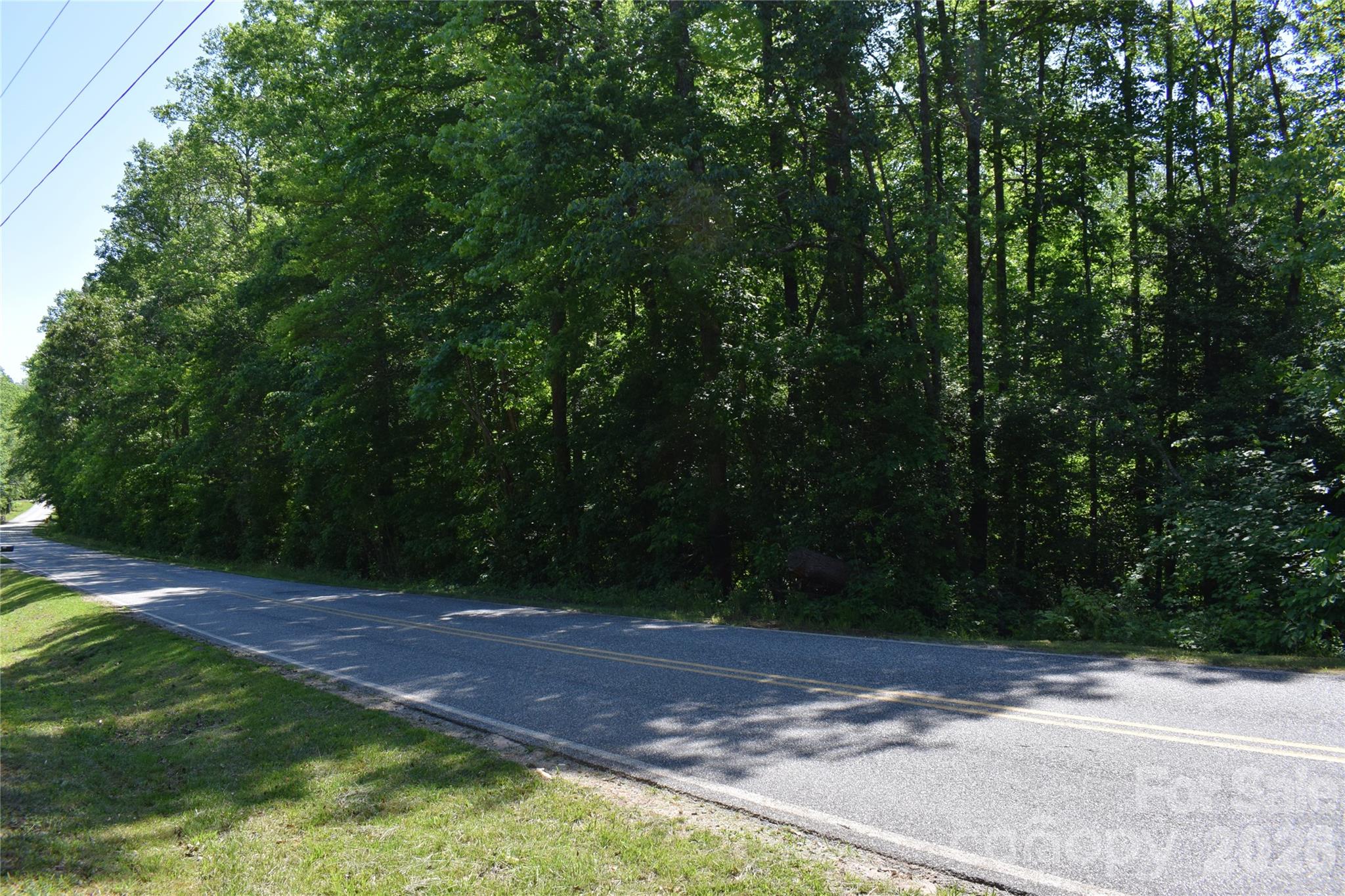 Nearly 19 acres of breathtaking wooded paradise in the sought after Greek Creek Community. Beautiful Mill Creek winds gracefully through the front of the property, creating a peaceful natural setting where deer, turkey, and local wildlife thrive. Tucked away just off Highway 9, this property offers the perfect balance of privacy, convenience, and untouched beauty. With no deed restrictions, the possibilities are endless for building, recreation, investment, or creating your own private retreat. Mature timber provides added value and potential income opportunities. Featuring approximately 900 feet of road frontage on Floyd Blackwell Road, this rare tract offers space, freedom, and the kind of natural beauty that is becoming harder to find.  Closest address for GPS purposes is a home across the street at 1441 Floyd Blackwell.  Sign on the property.