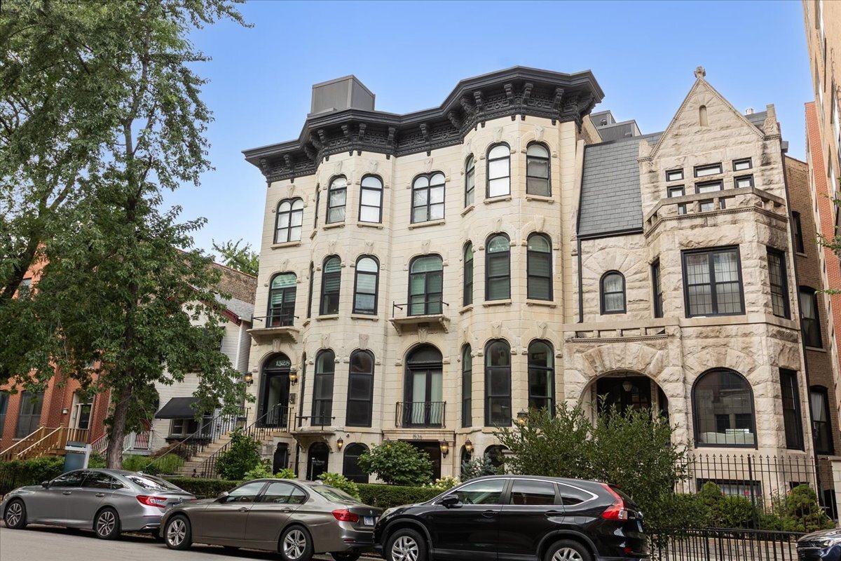 Light-filled 3 bedroom, 2.1 bath home in a prime West Loop location. An open living/dining room showcases a marble-detailed fireplace, crown molding, and bay windows that invite all-day natural light. The kitchen features stainless steel appliances, 42" cabinetry, quartz counters, and an island with breakfast bar seating. Spacious primary suite with dual vanity, deep jetted soaking tub, and separate shower with body sprays. A custom built-in bookcase in the second bedroom creates an ideal study and adds smart storage. Brazilian cherry hardwood floors run through the living spaces, and closets are professionally organized. In-unit laundry (stackable W/D). Attached garage parking INCLUDED. Enjoy a beautifully landscaped common courtyard perfect for entertaining. Unbeatable access to Downtown, expressways, Skinner Park, award-winning West Loop dining, boutiques, and public transit.