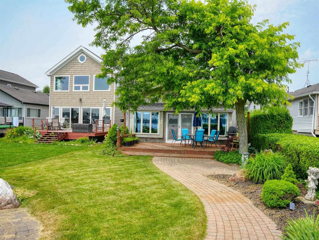 Looking for a getaway to call home? Anxious to sit in your backyard, enjoy the water, fish, and watch the freighters pass by? This is a beautiful home located on the St. Clair River, and set inside a large sized lot. The home has custom designed and built in large windows to provide a perfect view of the waterfront. The entire home has been recently updated and is ready to move in. This home sits off a private and quiet road, has a long driveway, attached garage, and multiple spaces for your house guests or family. With two master suites, a large open living room, and beautiful kitchen, you'll be able to enjoy views of the water throughout the home. This home also has an outdoor brick patio area perfect for entertaining all summer long, as well as a garden area, storage shed and beautiful, simple, easy to upkeep landscaping. On the waterfront, you have access to your own personal boat hoist with quick, easy access to the River.