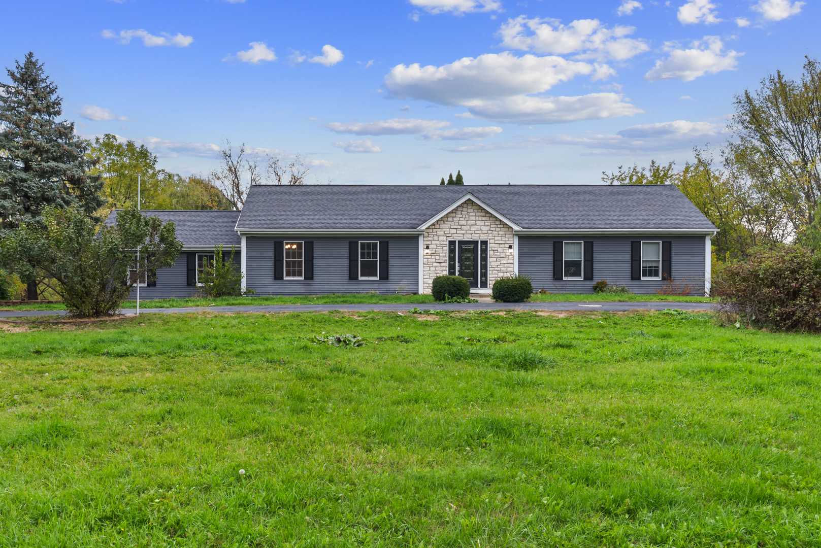 Ranch-Style Retreat on 1.7 Acres in West Dundee. A rare opportunity to own a home that blends value, luxury, and potential all in one. Enjoy breathtaking pond views, a circular driveway, and a light-filled open layout designed for comfortable living. The chef's kitchen features 42" white cabinets, stainless steel appliances, and a composite deck overlooking the water. Relax in the cozy family room with white-beam ceilings and a fireplace offering panoramic views of the yard. The private bedroom wing includes three spacious bedrooms and a spa-inspired primary suite with heated floors and a walk-in closet. The finished walkout basement adds a 4th bedroom, full bath, and bar-perfect for entertaining or extended stays. Complete with a 2.5-car garage and serene surroundings, this home delivers endless potential. With the right vision, it could become your dream home. Schedule your private tour today!