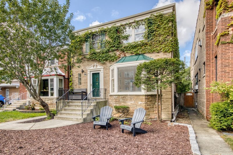 Welcome home to this delightful 3-bedroom residence nestled on a serene, tree-lined side street. The main level boasts a spacious open-concept living and dining area, perfect for both relaxing and entertaining. French doors open into a cozy family room that overlooks the private backyard, creating a seamless indoor-outdoor flow. A convenient half bath completes the main floor.  Upstairs, you'll find three generously sized bedrooms, including a king-sized primary suite with a large, custom walk-in closet designed for optimal storage and style.  The finished lower level offers a unique retro-style family room complete with a built-in bar-ideal for hosting game nights, movie marathons, or weekend gatherings. There is also a half bath conveniently located on this level as well.  This home with its spacious rooms and functional floorplan is ready to be taken to the next level at a great price point! Don't miss your chance to make it yours!