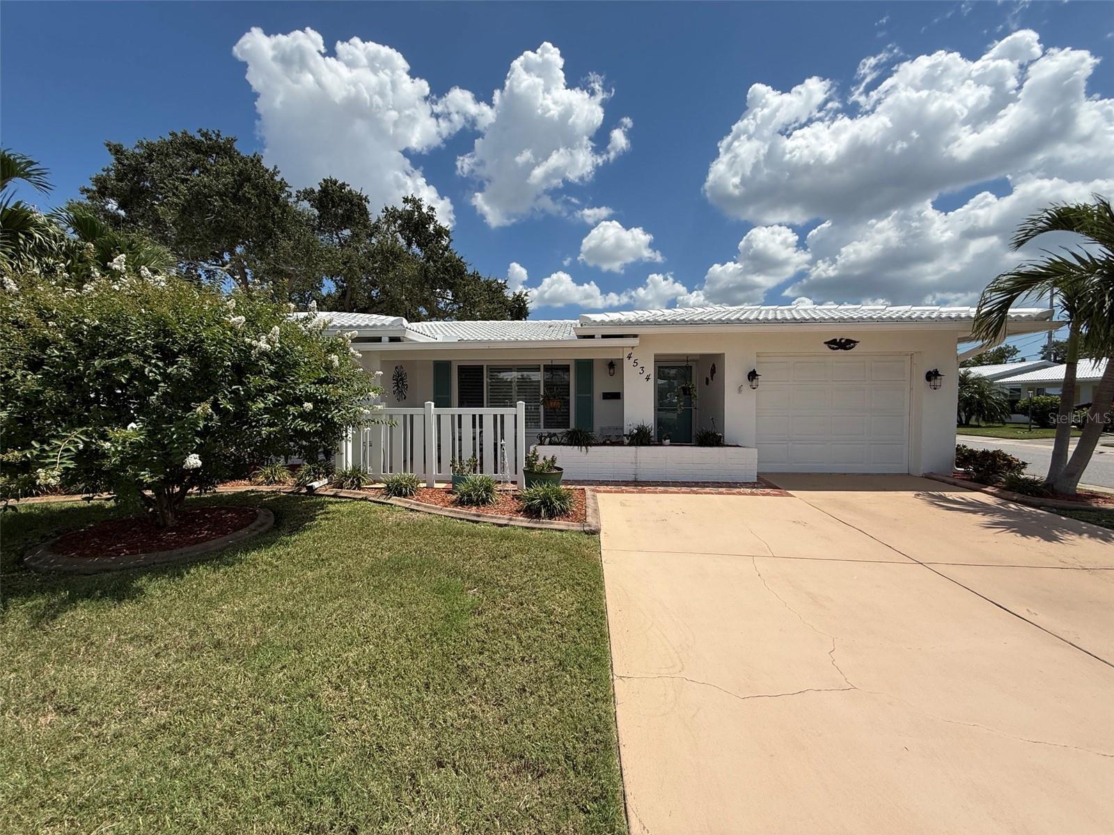 Tastefully updated home in the Mainlands, in Pinellas Park. Don"t miss this lovely 2 bed, 2 bath home with single car garage on a corner lot.Kitchen features wood cabinets with Quartz countertops and stainless steel appliances. Beautiful upgraded bathroom with exhaust/ heater fans. The Mainlands is a active adult retirement community that offers so many activities, you can't do them all. Close to shopping, restaurants, Churches and so much more. Close to the interstate, airport, beaches and just a short drive to major sport teams locations. The following are covered by the HOA dues; lawn maintenance, water, sewer, trash, exterior painting, roof replacement, cable, internet, clubhouse and pool. This is the place you want to be.