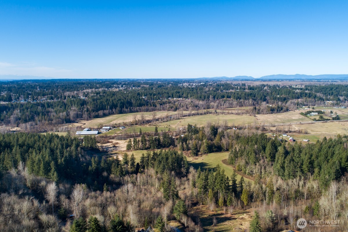 "Amazing Views" Imagine following the first rays of the morning sun past the river valley and farmlands below, past all of King County to the Seattle skyline, then to Mt Baker on clear day. Take a deep breath, it’s all yours. Level cleared site framed by mature cedars sets the stage. This 5-ac. parcel is sloped away from the approximately one acre building site to elevate & guarantee that your views stay! Bring your custom plans: Seller provides approved conceptual site plan; 4 bd. septic design, drilled well produces 55 gal per minute, & approved geo-tech reports all make this an easy process. OWNER FINANCING AVAILABLE!