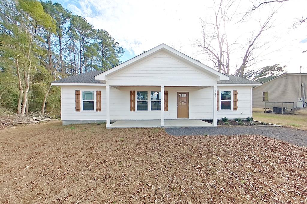 Welcome home to sweet Southern living at this beautifully built new home at 1021 11th Ave NW in Moultrie, GA. From the moment you step inside, the vaulted ceilings and open floor plan create a light-filled, welcoming space that feels just right for everyday living and gathering with loved ones. The living, dining, and kitchen areas flow together effortlessly—perfect for suppers, celebrations, or quiet evenings at home. Thoughtful woodwork and quality craftsmanship are woven throughout the home, adding warmth, character, and a sense of care you can truly feel. The kitchen and baths feature timeless quartz countertops paired with clean, well-finished details, while the spacious primary suite offers a peaceful retreat with a generous walk-in closet. The utility room is both practical and well-designed, complete with a washer, dryer, and pantry shelving to keep daily life organized. Step outside to a fenced backyard with an 8-foot double gate, offering privacy and flexibility for entertaining or outdoor projects. And of course, the front and back porches—finished with classic tongue-and-groove wood ceilings—are made for rocking chairs, sweet tea, and slowing down at the end of the day. This home blends modern comfort with true Southern craftsmanship and hospitality, ready to be loved from day one.