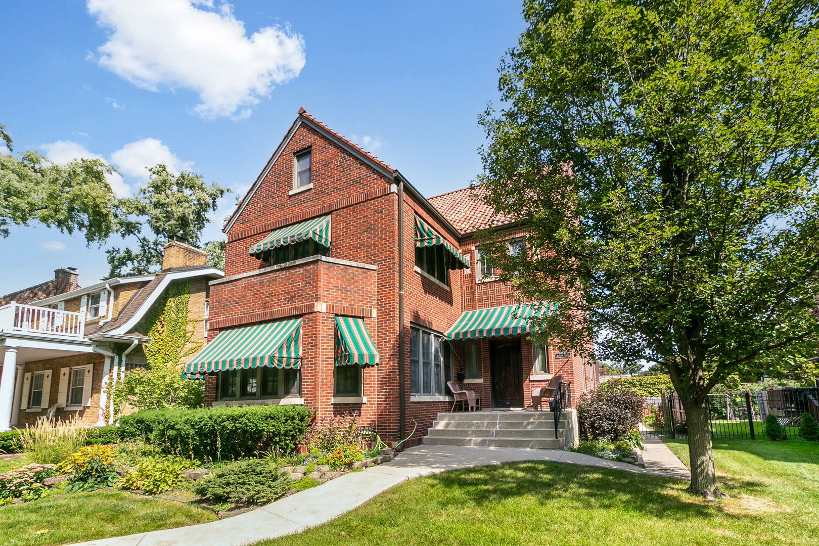 Step into a piece of Chicago's Architectural history with this stunning Hetherington home. "Hetherington Homes" refers to residences designed by three generations of the Hetherington family of architects, primarily in the Chicago area from the late 1880s to the 1960s. This 3 story beautiful gem is nestled in the heart of the Beverly neighborhood, and features 4 bedrooms, 3 full, and 2 half baths, hardwood floors and beautiful woodwork throughout, a gas fireplace in the Livingroom. One bedroom features an office/sitting room and another has a balcony overlooking the backyard. The kitchen is open and bright with Cherry wood cabinets, newer appliances and a slate floor. The finished basement has a wet bar, as well as plenty of storage. The exterior features a composite deck, stamped concrete patio, and a wrought iron fence, as well a a two car detached garage. Meticulously maintained, filled with warmth, and ready for its next chapter.