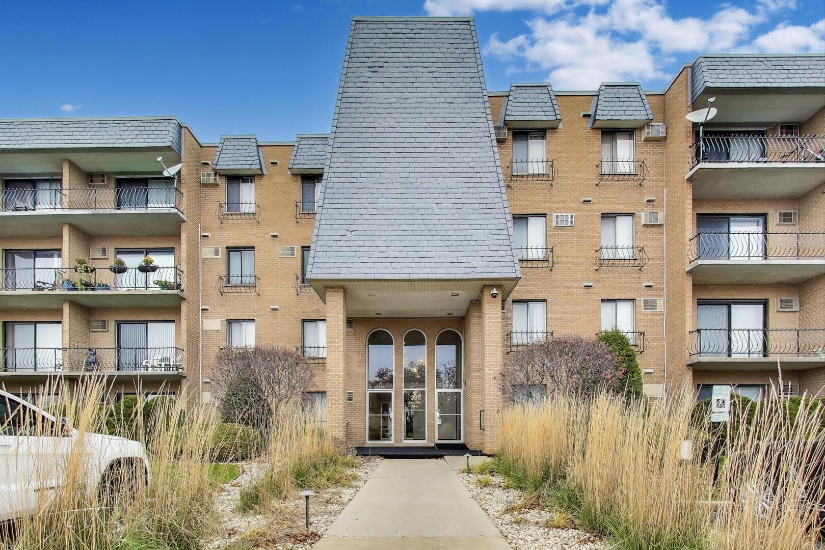 Your search is over! Step into this great condo located in a beautifully maintained and secure building. This spacious unit features 2 large bedrooms-including a primary bedroom with dual closets-and 2 full baths. The unit comes with 2 parking spaces.   Enjoy comfort year-round with three wall A/C units. The generous living room opens to a semi-private balcony where you can relax and take in the peaceful, tree-lined view. No rentals and no pets are permitted in the building, ensuring a quiet and stable community.  This is an estate sale. Units 133 and 113 are being sold separately but can also be purchased together as a bundle.