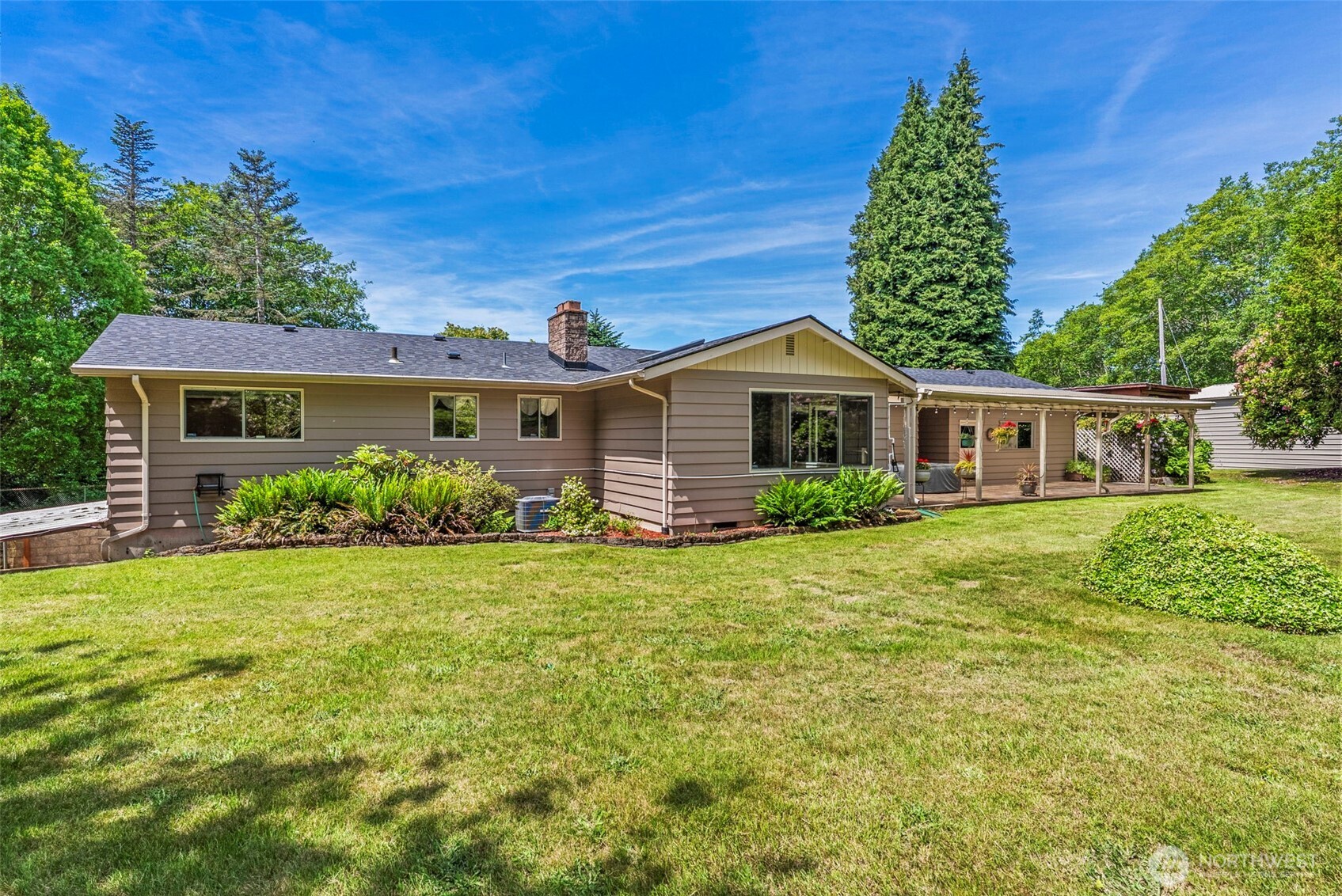 Meander down the tucked away drive & find your way to this meticulously kept, sturdy built, beautifully maintained home along the golf course. Gorgeous hardwood floors, breakfast nook, well-appointed kitchen, large formal dining alongside large, natural-lit living room w/warm inviting feel & pleasing views of the patio overlooking the sculpted backyard. Spacious bedrooms, full bath & true utility room finish out the main floor allowing for one-level living; BUT, down the stairs you'll find a huge bonus room w/kitchenette, giant bedroom, 3/4 bath, closets, storage and walk-out from the daylight basement to private covered porch that leads to a large, fenced side yard. Lots of opportunity in this 3,000 sq ft home, 24x 40 RV-port on 2+ acres!