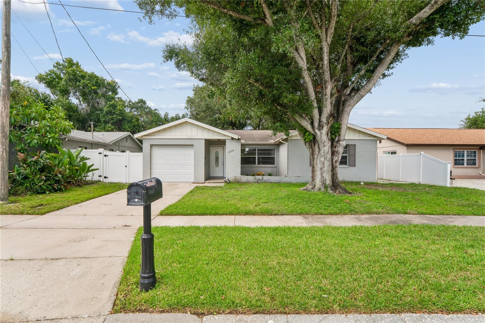 Welcome to 10275 56th St! This updated 3-bedroom, 2-bathroom property offers over 1,200 square feet of living space, a single car garage, dedicated laundry room, and a fenced-in backyard!! The home is move-in ready with updated LVP flooring and a kitchen that includes stainless steel appliances, white shaker-style cabinets, and quartz countertops. The floor plan provides plenty of room for entertaining in the living room, which flows seamlessly into the dining room, kitchen, and beautiful backyard. The primary bedroom has sliding glass doors and also offers an en-suite bathroom with a walk in shower with custom tilework. The additional bedrooms share the second full bathroom. Conveniently located near schools, shopping, and major roadways. Call to schedule a showing today!