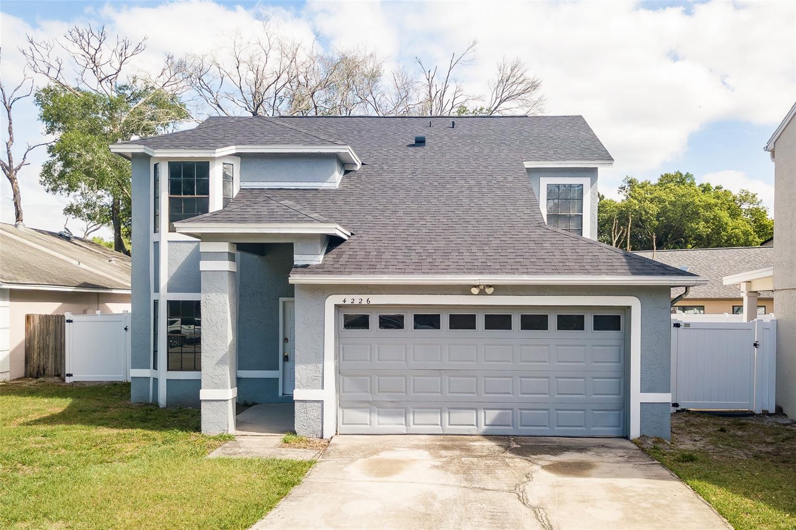 Looking for a spacious 4-bed 2-bath pool home recently updated with a brand NEW 2026 ROOF, NEW FLOORING IN THE ENTIRE UPSTAIRS AND PRIMARY BEDROOM, NEW FENCE, and NEW TOILETS? Once you step inside the front door of this beautiful home you are greeted with a huge main living space with a stunning two-story ceiling, an entrance to your kitchen, and another to your first floor primary bedroom and bathroom! Out the sliding glass doors you will find your screened-in private pool, a fenced-in yard, and a covered area perfect for entertaining! The home also boasts  A 2-car garage,  generously sized secondary bedrooms, and tons of natural light! Location is awesome close to everything orlando has to offer and a very short drive to the 417, Oviedo, and much much more! This home is priced to sell so contact us today to schedule your private showing!