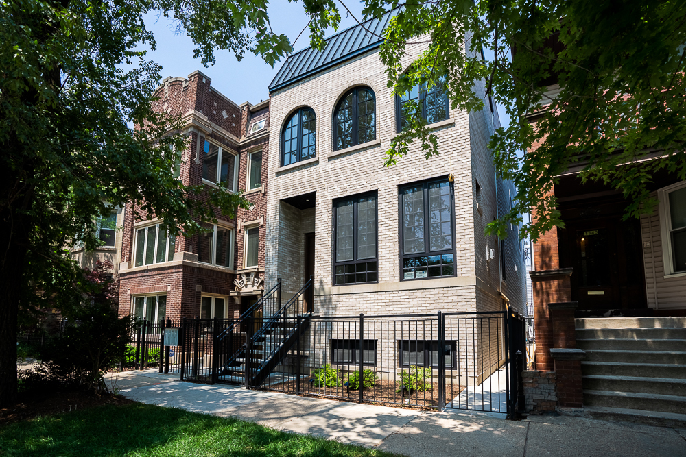 Welcome to 1342 W Wellington Ave, a remarkable new construction home located in the heart of Lakeview, complete with a 600 sq. ft. coach house-perfect for guests, extended family, in-laws, additional office space or rental income. This modern, three-story residence offers 4,800 sq. ft. of thoughtfully designed living space, featuring 7 spacious bedrooms and 6 and half bathrooms. Crafted with luxurious, top-of-the-line finishes, the home combines elegance and functionality for a contemporary lifestyle. The chef's kitchen is a true standout, equipped with state-of-the-art Sub-Zero and Wolf appliances, a built-in coffee system, a large island, and dual walk-in pantries. The open layout flows seamlessly into bright, expansive living areas that are perfect for both entertaining and relaxing. Upstairs, enjoy a rooftop deck spanning over 1,000 square feet, offering sweeping views and an ideal setting for outdoor gatherings. Just off the family room, a terrace patio extends the living space outdoors. The fully finished basement includes a spacious recreational area, a custom wine room, a wet bar with fridge and a separate laundry room a with dedicated dog shower. Designed with comfort, style, and convenience in mind, this home delivers on every level. Situated just steps from the Southport Corridor, parks, top-rated schools, restaurants, and boutique shops, this is a rare opportunity to own a true masterpiece in one of Chicago's most desirable neighborhoods.
