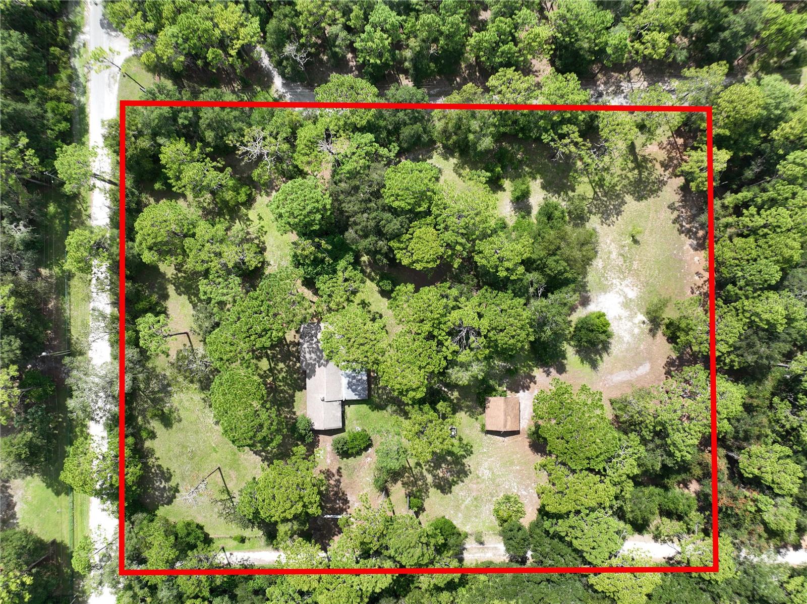 Welcome to your own private piece of Florida paradise! Nestled on 3.3 acres of beautifully manicured, flat land, this charming 2-bedroom, 2-bathroom home offers plenty of space, privacy, and the perfect blend of comfort and country living. The property features beautiful mature trees and expansive grounds that provide a peaceful, park-like setting with endless possibilities for outdoor enjoyment, gardening, recreation, or simply relaxing and enjoying the natural surroundings. Recent improvements include fresh interior and exterior paint, new soffits, and stainless steel appliances, giving the home a clean, refreshed feel and making it truly move-in ready. Inside, the well-appointed layout offers two comfortable bedrooms and two full bathrooms, along with inviting living spaces designed for everyday living. The attached two-car garage provides convenient parking and plenty of additional storage. With 3.3 acres of flat, well-maintained property, mature landscaping, and numerous recent updates, this is a rare opportunity to own a spacious piece of land while still enjoying the comfort and convenience of a move-in-ready home. Come experience the privacy, beauty, and possibilities this special Brooksville property has to offer!