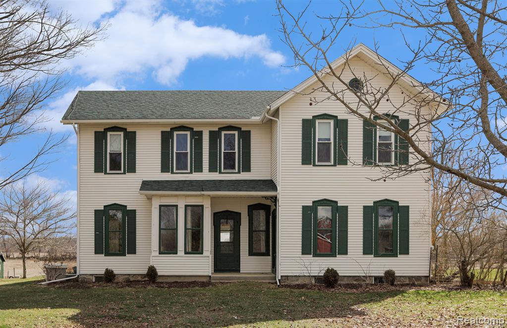 A special piece of Dexter history awaits its next owner. This well-loved farmhouse blends classic character with a flexible layout suited for modern living. Highlights include 10-ft ceilings, original honey pine and oak floors, and abundant period charm. The spacious kitchen and family room—anchored by a cozy gas fireplace—serve as the heart of the home. The main floor features a primary suite, laundry, living room with alcove, den or optional bedroom, sunroom, and two full baths. Upstairs offers three bedrooms, a full bath, and a large playroom. Outside, multiple outbuildings provide space for storage, animals, or future projects. Recent updates include central A/C, updated plumbing and electrical, fresh paint, and a whole-home generator. Set on 5 acres, the property is bordered by conservancy land across the street and along one side, preserving the views, privacy, and natural surroundings.