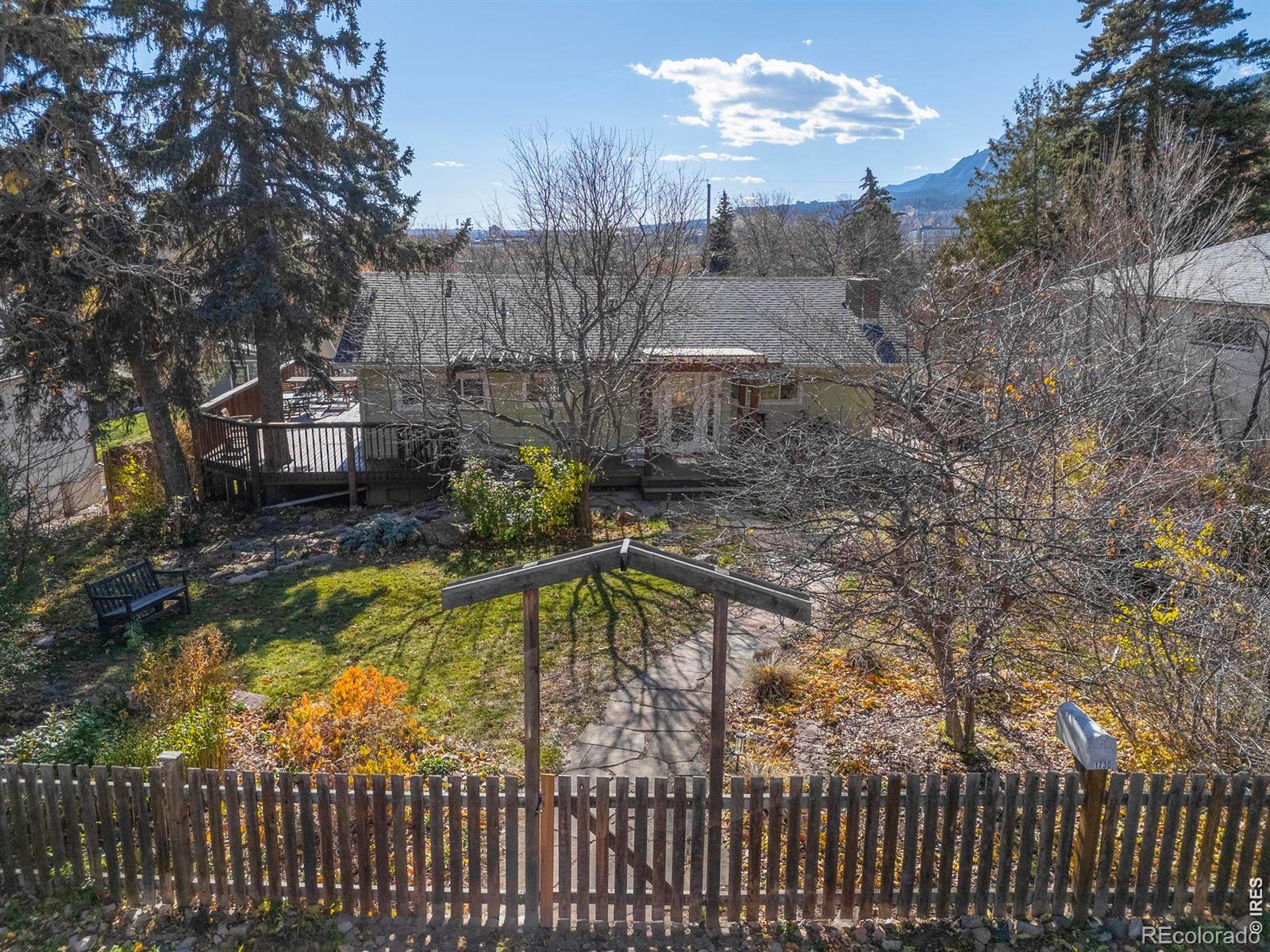 Opportunity to own this one of a kind location in Boulder. Property is ready for enhancement to the current dwelling which will benefit from renovation or to create the space you've always dreamed to own. Currently ready for rental (the current owner rented the property over the last several years) while you make your plans for the new home. Sunset Hill sets the stage for this exceptional Boulder property, capturing the essence of downtown living with rare space, flexibility and iconic Flatirons views. Set on an oversized 1/3-acre lot along a quiet cul-de-sac, this bungalow-style ranch enjoys southern exposure and effortless access to Pearl Street, trails and open space. Inside, vaulted ceilings, skylights and hardwood floors create a light-filled, airy ambiance, complemented by updated baths and a gas fireplace. The open floorplan offers comfortable main-level living, while the walk-out lower level presents ADU potential, ideal for rental income, guests or multi-generational living. Outdoor spaces shine with mature trees and a wraparound deck designed to take in city and mountain views. An expansive 1,000-square-foot detached garage/workshop with alley access offers opportunity for further rental revenue, room for six vehicles, creative pursuits or future conversion . With incredible development potential and a prime location, this home offers a rare opportunity in the heart of Boulder.