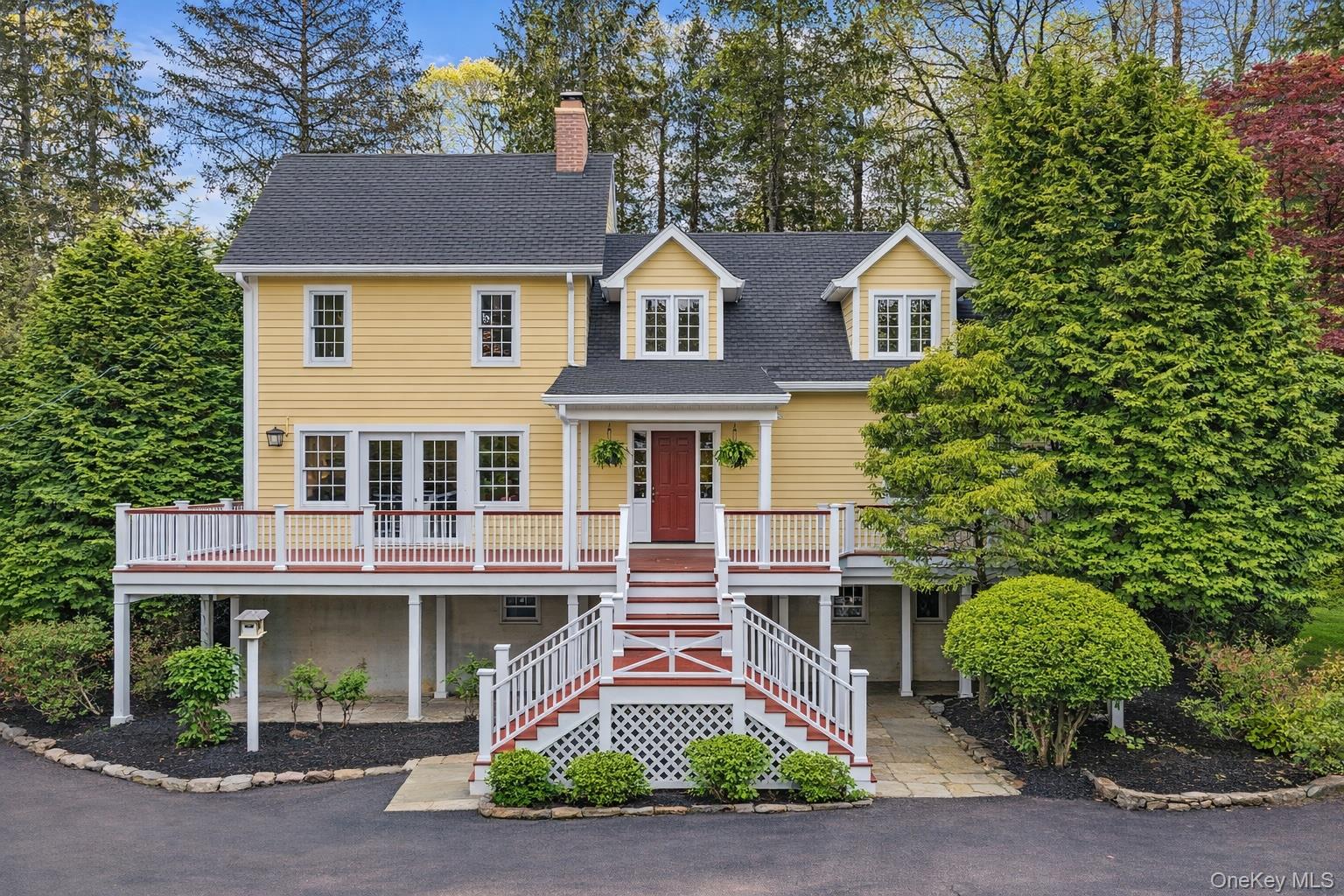 This charming 3-bedroom, 2-bath home sits on just over two private, tree-lined acres in the North Salem School District. Accessed by a newly paved driveway, tree lined driveway, the home looks out over the recently relined above-ground pool and front yard. Indoor/ outdoor living is easy with a partial wraparound deck leading to a rear patio with firepit and a second wraparound deck with access from the living room, kitchen and office. As you step inside the foyer with a mirrored closet, you immediately feel a sense of calm.  The dining area features a striking fireplace and to the right is an open concept kitchen with deck access.  An office with sliding doors to the deck, a full bathroom and spacious living room complete the first floor. Upstairs, are two guest bedrooms, a full hall bath, and a spacious primary bedroom with high ceilings and California closets. The partially finished basement includes a recreation room, laundry room and direct walk-out to the driveway. Additional highlights include a heated one car garage with an electric car charger and workbench as well the above ground pool and pool house as well as a gardening shed. Conveniently situated close to shopping, restaurants, public transportation, the Metro-North train station, and I-684.