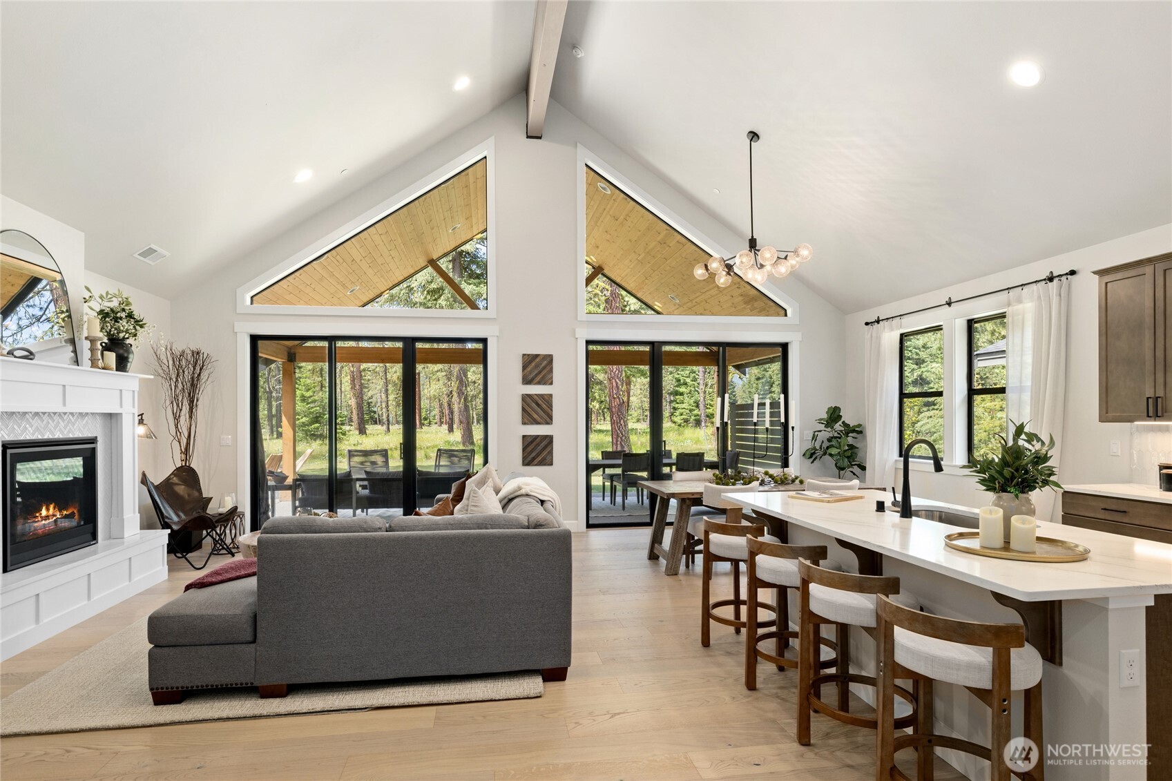 Bright open, and inviting living room with large beam.
