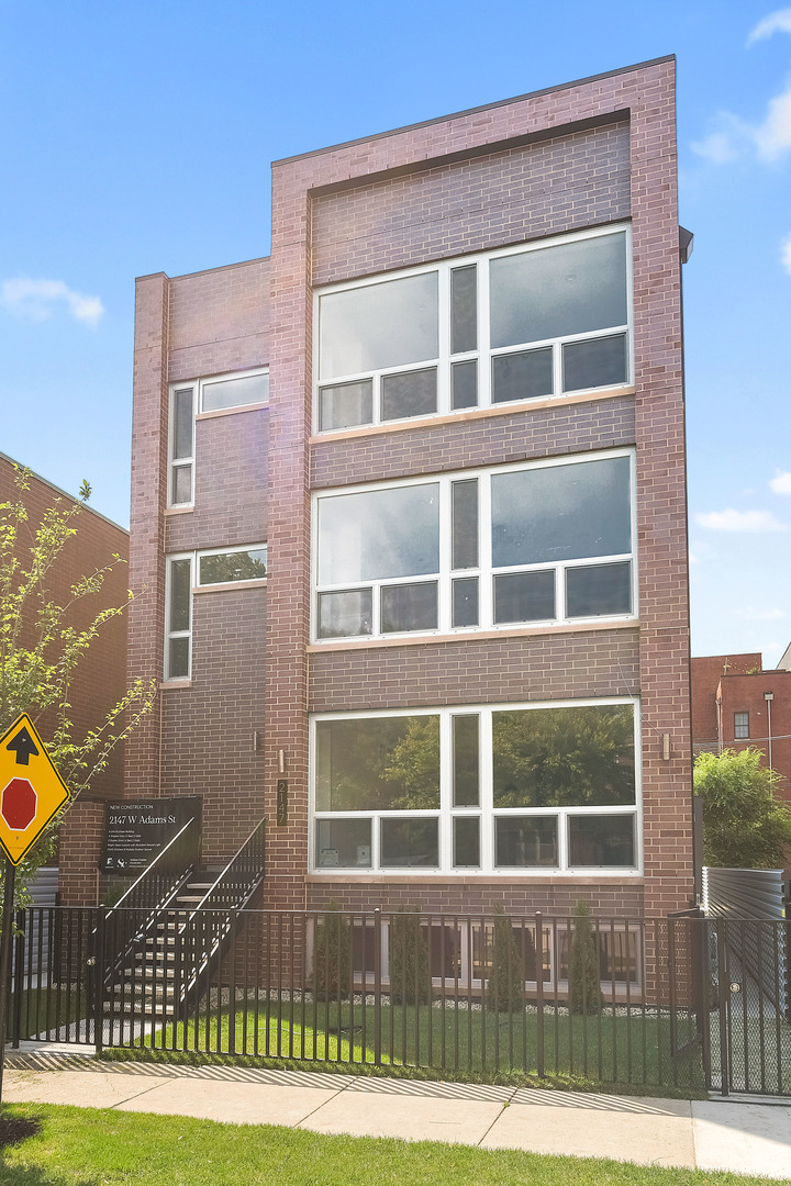 READY FOR OCCUPANCY! Discover an amazing opportunity to own this brand-new, beautifully designed 4-bedroom, 3-bathroom duplex in a unique 6-unit building in the heart of United Center and The 1901 project. This spacious duplex-down features an expansive living and dining area, perfect for entertaining. The living room is highlighted by huge floor-to-ceiling windows, flooding the space with natural light. The chef's kitchen boasts custom cabinetry, huge quartz countertops, and stainless steel appliances, making it both stylish and functional. The main level includes a large bedroom and full bathroom, while the lower level offers three additional bedrooms. This includes a luxurious primary suite with a walk-in closet and a spa-inspired bathroom, as well as two large bedrooms with spacious closets and an additional full bathroom. Enjoy private front entry access, a garage parking spot, and additional outdoor space with a roof deck above the garage-ideal for relaxing or entertaining. Don't miss this incredible home in a prime location! Schedule your private showing today. Estimated completion date August, 2025. Conveniently located near West Loop, Little Italy, United Center and Medical District. Easy access to Eisenhower Expressway / 290, Blue line El Train stop, Western Ave Metra Stop for MD-N, MD-W, & NCS, and CTA buses.**Special alert***This property qualifies for special financing through Citibank which includes a $7500 closing cost credit from the lender, below market interest rate (6.5% today subject to change daily), no PMI (private mortgage insurance), and only 3% for down payment (conventional loan). Between no PMI and the below market rate this will get your clients monthly payment down another $500-600 per month for any fence sitters out there. Find more information and lender's contact in the agent's private remarks.