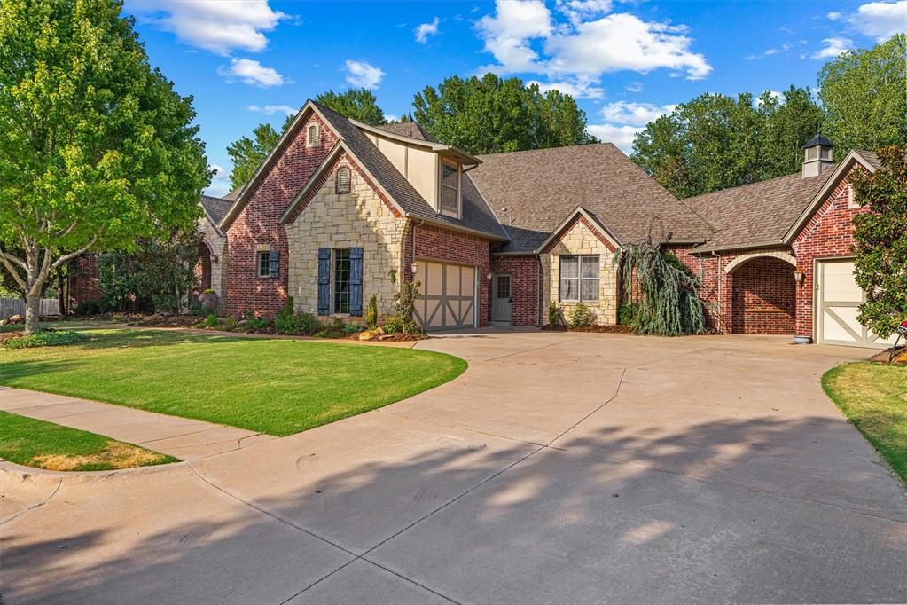 Experience refined French Country living at 3904 Creek Bend Road in Edmond, Oklahoma. This impressive one-owner luxury home offers 5 bedrooms, 5 bathrooms and 4,239 square feet of thoughtfully designed living space. Built in 2007, the home showcases rich hardwood floors, beautiful stained-wood cabinetry, doors and trim, along with fresh interior paint and new carpet.The spacious floor plan features a dedicated home office, multiple living areas and an upstairs suite offering added flexibility. The expansive primary suite includes a generous walk-in closet, while the theater room, complete with a bar, creates the perfect setting for movies and entertaining. A large laundry room adds valuable storage and everyday functionality.Parking and workspace options include an attached two-car garage with a storm shelter, built-in cabinets and workbench, plus a detached single-car garage ideal for a workshop or additional storage. A graceful portico connects the garages and creates a distinctive gateway to the backyard. The property also offers an opportunity for electric-vehicle charging.Designed for exceptional indoor-outdoor living, the greenbelt, wooded backdrop and mature shade trees create a peaceful setting. Enjoy the covered patio with outdoor speakers, outdoor fireplace, large hot tub and tranquil waterfall. Automated features include window shades, Wi-Fi-enabled lighting, landscape lighting, a sprinkler system and drip irrigation for flowerpots. Additional features include hardwired smoke alarms, security system, and a full home Generac generator.The neighborhood offers HOA-maintained greenbelt and common areas. Located within Edmond Public Schools, this Edmond luxury home provides convenient access to I-35 and the Kilpatrick Turnpike, as well as nearby public parks, golf courses, the University of Central Oklahoma, shopping and dining. Contact us to schedule your private tour of 3904 Creek Bend Road today!