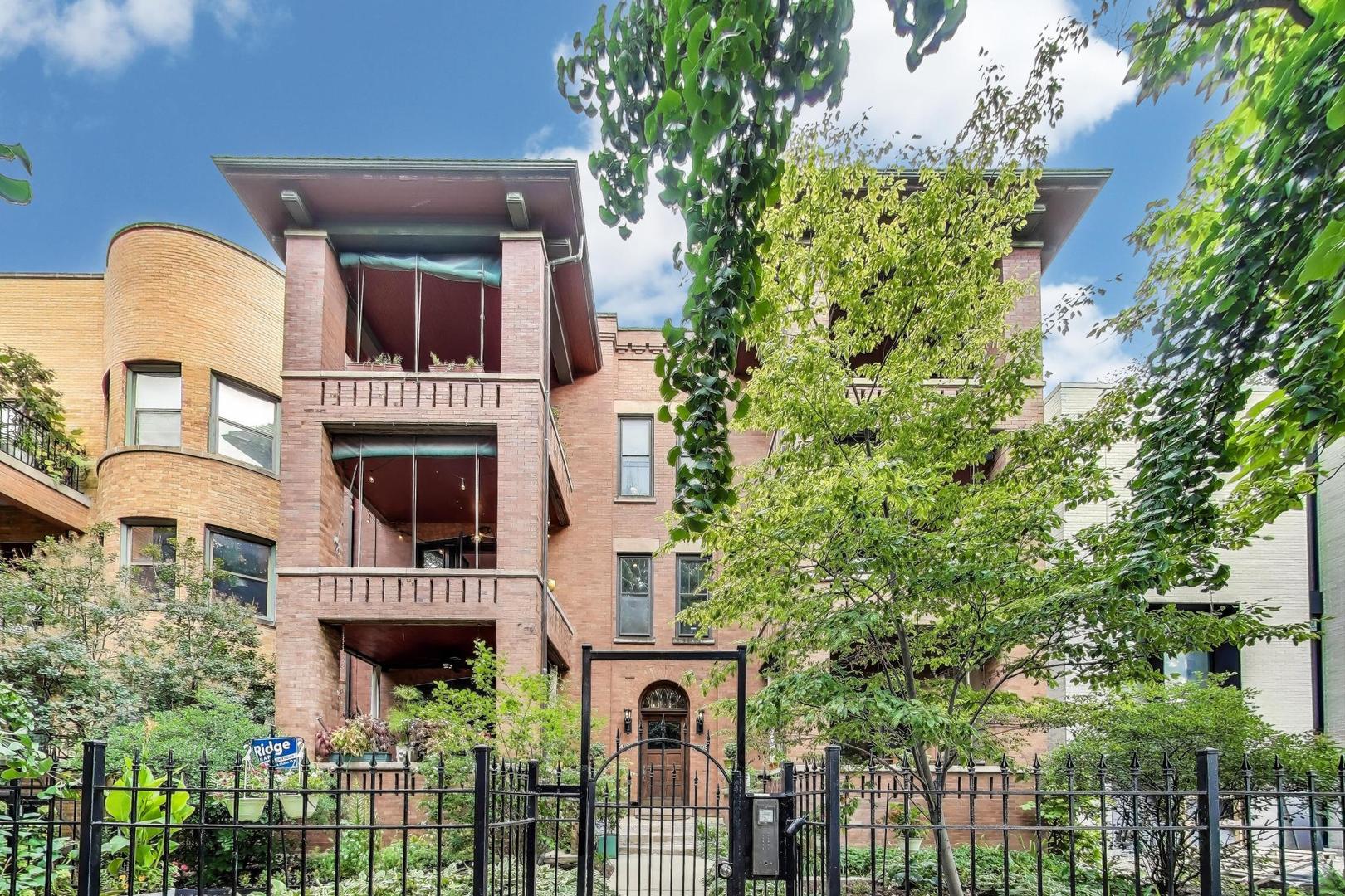 Welcome home to this amazing vintage condo on one of the most beautiful streets in Sheridan Park. An incredible marriage of vintage and modern, striking exposed brick, warm detailed millwork, glowing hardwood floors, high ceilings, beautiful muntined windows and French doors, and a spectacular wood burning fireplace add warmth and charm from the moment you walk in the door.  Spacious, extensive living dining room area.  A separate den/office, new (2019) kitchen with Martha Stewart cabinets, stainless appliances, loads of counter space and storage.  Two large bedrooms (one queen sized, one king sized).  Both with walk in closets.  Huge primary bath with a lot of possibilities. Hall bath completely redone in 2024.  Stackable washer/dryer new in 2021. Bucolic front balcony complete with planters, shades and water will be your refuge 3 seasons of the year.  Rear deck perfect for the Sunday New York Times with your morning coffee. There is a large shared deck and yard which will amaze.  One garage space included along with a huge storage room.  The building is very loved and well maintained-roof patched (2024), new back decks (2017), decks stained (2022), electric service to garage (2024).  Unit had a new HVAC in 2022, HWH (2017).  Custom window treatments add a lovely finishing touch.  Welcome home to this amazing vintage unit in an incredible location with shopping, coffee, restaurants, transportation close by and convenient.  Come see the unit that will check all your boxes.