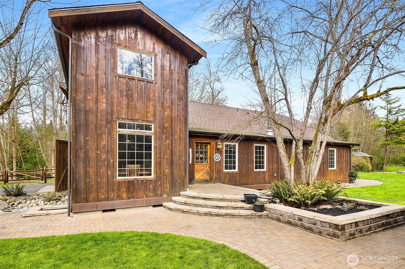 LUXURY BARN LIVING! Discover this exceptional 21 acre self-sustained homestead, offering a perfect blend of natural beauty. The spacious property features lush fields, and a majestic expansive mixed forest.  Highlights include a reclaimed timber frame barndominium planned for expansion, complete with a 4-bedroom septic system. The versatile buildings and amenities include: A spacious shop it's own 200 amp service, an upper-level area, a dedicated freeze-dryer/canning room, a mechanic workroom, a four-bay carport, a garden shed for tools and supplies, a pole barn suitable for RV or trailer storage, a tractor and woodshed area, an adorable timber-frame outdoor entertainment structure, a covered hot tub area overlooking a peaceful small pond. The charming, isolated home features a master bedroom with French doors opening onto a covered porch, perfect for relaxing and enjoying the natural surroundings. Locally reclaimed fir floors add an organic rustic touch. Set within a private yet close-in location, this retreat offers excellent connectivity to I-5 for convenient travel. Expansive railed pastures provide ample space for horses, livestock, or other outdoor pursuits. The entire property is flat, with plenty of room to build your dream home, horse arena, or additional structures. This property combines the tranquility of nature with practicality of a well-equipped homestead - an ideal place for sustainable living, recreation and future expansion.