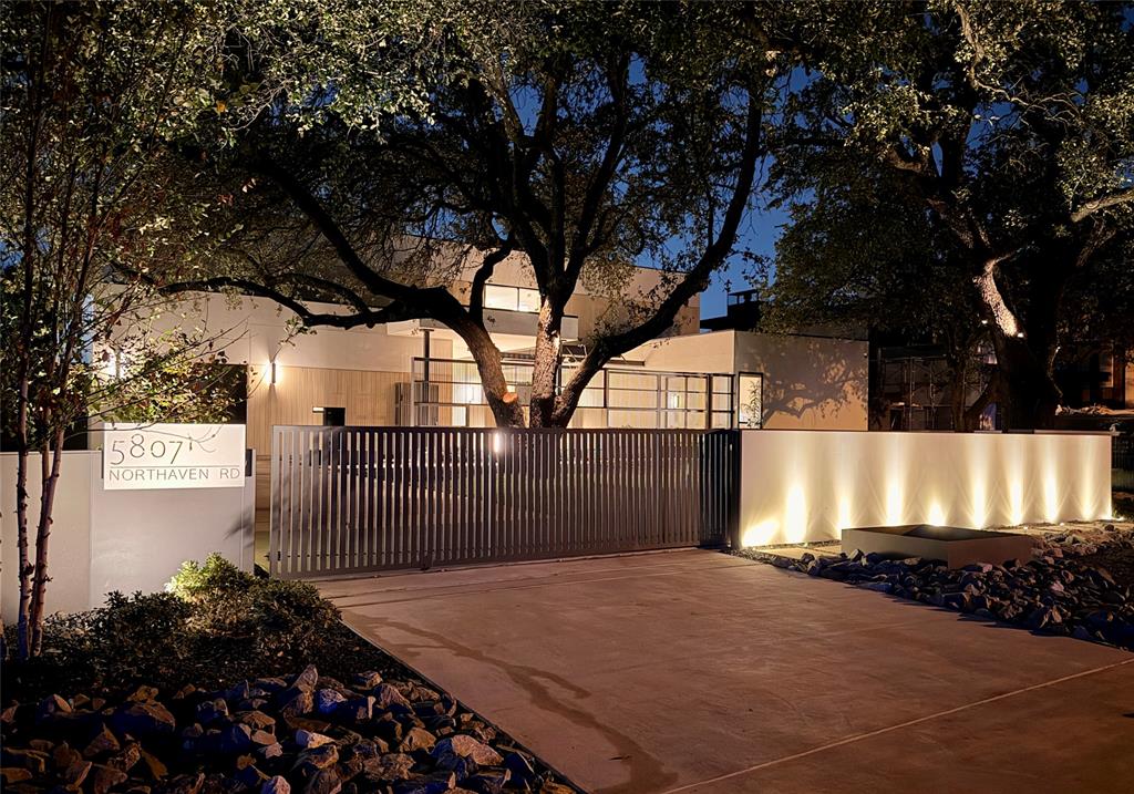 Discover modern luxury in the prestigious Preston Hollow neighborhood of Dallas. Showcasing the exceptional design of DOLE Homes, this brand-new architectural masterpiece blends timeless design with striking contemporary architecture and refined finishes. Spanning 7,103 square feet, this impressive residence offers 5 bedrooms, 5 full baths, and 2 half baths. The expansive chef’s kitchen features abundant custom cabinetry, a built-in Sub-Zero refrigerator, premium Wolf appliances, and a separate prep kitchen, seamlessly combining style and functionality. Generous open-concept living spaces create an inviting atmosphere for everyday living and elegant entertaining. The first floor features a luxurious primary suite and a second ensuite bedroom overlooking the gated front yard, offering excellent flexibility as a private home office or guest suite. An elevator adds another level of comfort and convenience. The second floor features three additional ensuite bedrooms, along with a welcoming living area and built-in bar, creating a comfortable retreat for family and guests. A spacious balcony overlooks the backyard oasis, offering beautiful views of the pool and outdoor entertaining spaces. The backyard is designed for resort-style living, featuring a swimming pool, outdoor kitchen, and fire pit, with ample green space remaining for recreation and relaxation. Gated access to both the front and backyard enhances privacy and exclusivity. Combining timeless design, exceptional craftsmanship by DOLE Homes, and luxurious indoor-outdoor living, this remarkable new Preston Hollow residence offers a sophisticated lifestyle in one of Dallas’s most desirable neighborhoods.