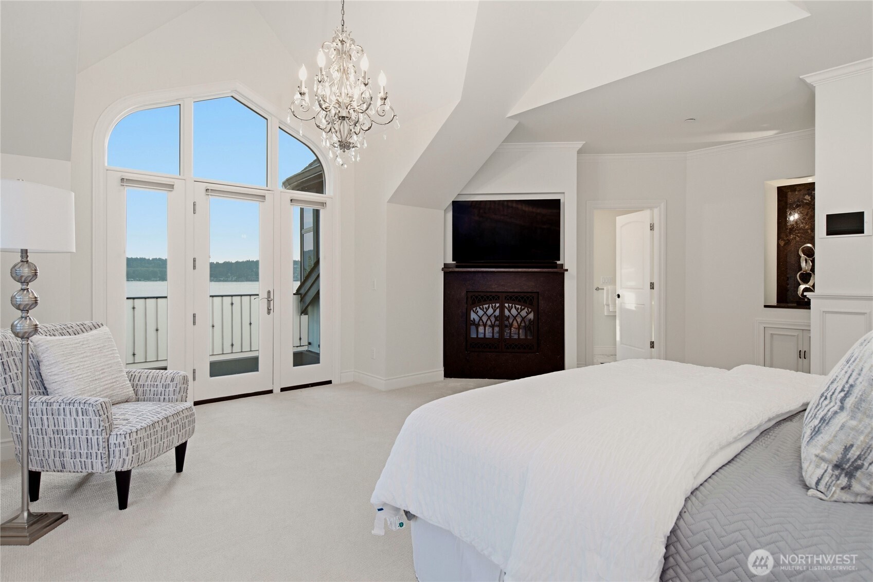 Lake Sammamish view primary suite with spa-inspired bath and peaceful waterfront outlooks.