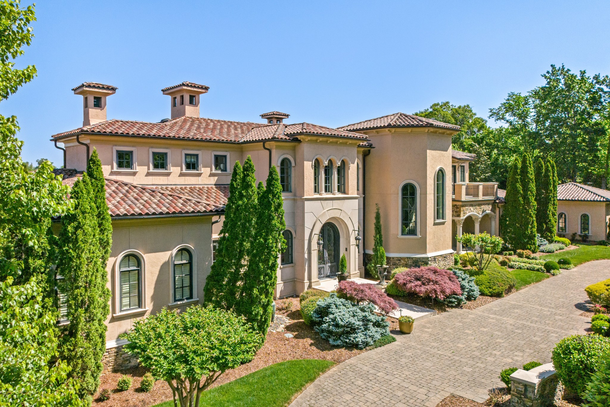 This stunning property sits on 1.81± acres in the Governor's Club. The home opens up to a gorgeous great room with views overlooking the third green of the golf course. The estate has been impeccably maintained and features custom architectural details of rounded walls, and venetian plaster. The main floor features a luxury kitchen, round dining room with walls painted by local artist Charlotte Terrell, and a bar with an 800 bottle wine cellar. The primary suite includes a spa-like bathroom, large custom closet, and a morning balcony. Each bedroom suite has its own walk-in closet and private bath. The terrace level includes an open entertainment space with a bar, multiple TVs, theater room, arcade room, bowling alley, exercise room, spa room with intensity shower/steam room and sauna. The outdoor space is perfect for more entertainment with a 10ft deep infinity-edge pool and hot-tub, a putting green, basketball/pickleball court, and grilling/dining areas. All 1.81 acres are irrigated with well water. In addition, there is a 5-car garage with an additional spot for a golf cart. Governors Club amenities include golf, dining, fitness, tennis courts, playground, and pool.