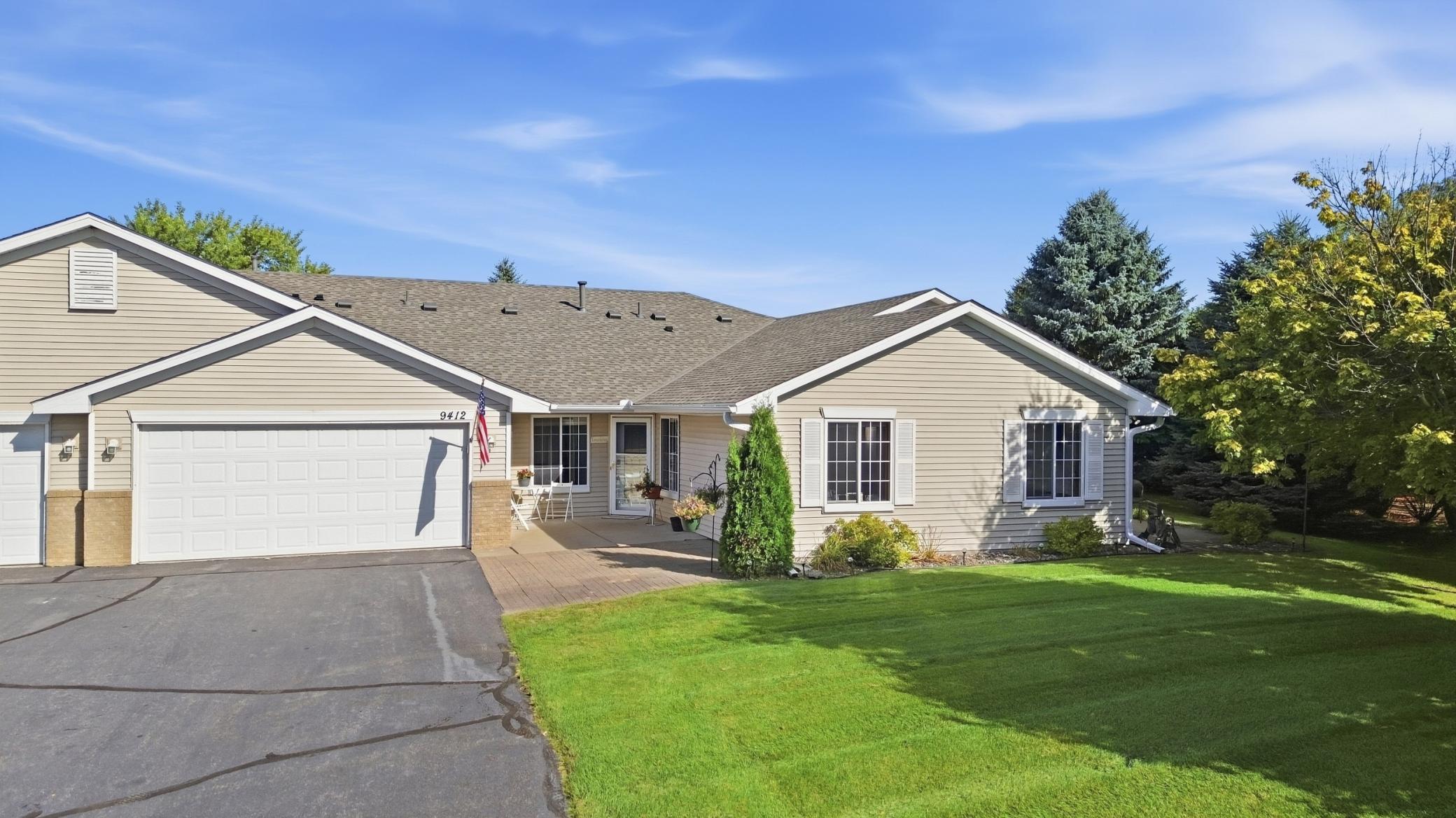 Welcome home to this well-maintained townhome in a highly sought-after community, offering the ease and convenience of true one-level living with no steps anywhere—including easy entry and exit. A welcoming entry patio provides a pleasant place to greet guests or enjoy the outdoors before stepping inside.The spacious living room opens to a bright sunroom at the back of the home, where abundant natural light, beautiful private views, and a cozy gas fireplace create an inviting space to gather or unwind. A private patio just off the sunroom offers another place to enjoy the peaceful setting.Vaulted ceilings and added recessed lighting enhance the spacious feel, while the home features hard flooring throughout, with flooring updates completed within the past three years. The functional kitchen offers plenty of space for cooking and storage, with both an eat-in area and a separate formal dining area.The large primary bedroom features a walk-in closet and private ensuite bathroom. The bathrooms include thoughtful accessibility features such as grab bars and a walk-in shower. An additional half bath provides extra convenience and is a feature not found in the other townhomes in the neighborhood.The two-car garage includes a separate storage room, and the garage is wired for a Tesla charger. Major updates to the home include a new roof and gutters in 2024, appliances less than five years old, and a furnace and A/C less than five years old.Enjoy quiet, low-maintenance living in this desirable townhome community, with convenient access to shopping, dining, schools, and the interstate.