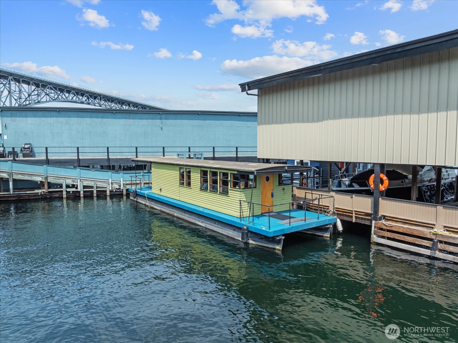 Welcome aboard your own piece of Lake Union paradise. This charming 420-square-foot houseboat offers the rare opportunity to embrace a simpler, more intentional way of living—where every morning begins with shimmering water views and every evening ends with unforgettable sunsets.  Thoughtfully designed for comfortable everyday living, this floating retreat is perfectly paired with a generous 52' slip, providing added flexibility and room to enjoy the waterfront lifestyle. Sip your morning coffee on the expansive covered deck, launch a paddleboard or kayak from your doorstep, watch sailboats drift by, or simply relax and soak in the ever-changing beauty of life on the lake.  Whether you're looking for the peace and tranquility of a full-time residence, a Seattle retreat, or a one-of-a-kind lifestyle investment, this houseboat offers an experience unlike any traditional home. Live surrounded by nature with stunning views while remaining just minutes from the city's best restaurants, shopping, and major employers.  Life on the water isn't just about where you live—it's about how you live. With a covered deck in back and an open deck in front, slow down, reconnect with what matters, and discover the rewarding experience of calling Lake Union home.