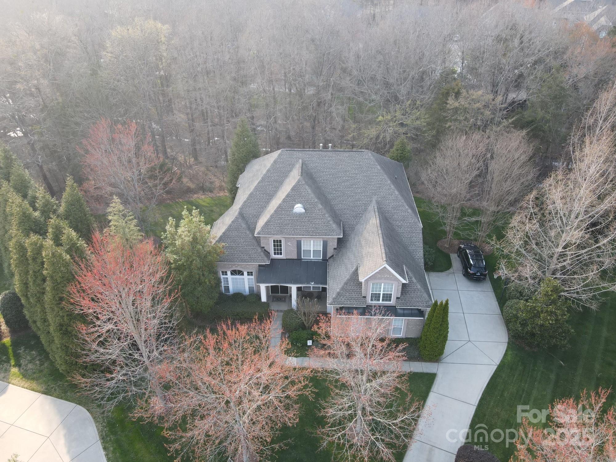 Updated full brick home with 3 car garage on wooded lot in a cul-de-sac.