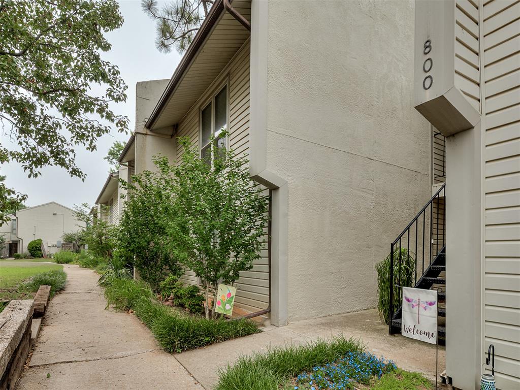 Wonderful opportunity to own this condo located inside a gated community right next to Jimmy Austin Golf Course and only 3 miles from OU campus. This 1 bed, 1 bath condo provides ample and peaceful living space with a spacious living room with gas log fireplace and a large built in bookcase with storage on the opposite wall. The kitchen has granite counter tops, electric stove with microwave above, refrigerator and dishwasher. The kitchen and dining areas have wood flooring while the living room and bedroom has carpet and tile in the bathroom/laundry. The bedroom provides 2 closets for clothing and storage. There is a storage closet in the hallway adjacent to the bathroom which has a tub shower with a combo stacked washer & dryer that stay with the property. There is a small private patio outside the kitchen to relax and enjoy nature. This unit is located close the community pool and clubhouse. Come and enjoy this wonderful community.