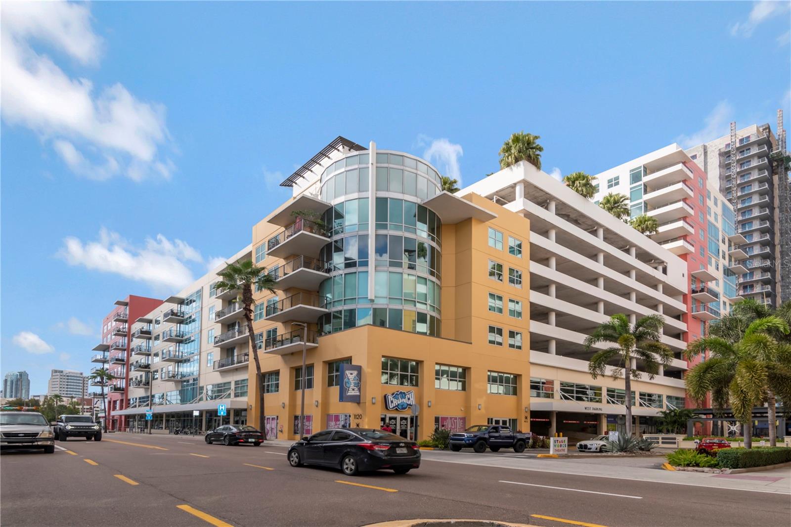 Welcome to the hottest area of Tampa to live!  This beautiful home at Grand Central on Kennedy is a professionally renovated split 2 br/2 ba unit with wrap a wraparound balcony loaded with extras to make your home a place you love coming back to!  Situated in Channelside convenient to downtown all Water Street, Sparkman Wharf, Benchmark arena and so many other ways to enjoy the area.  Within two blocks you will find multiple restaurants, Publix, Starbucks, Crunch Fitness, CVS, Madison Street Park which includes a dog park, pickleball, basketball and more. Your home includes 2 side by side assigned parking spaces on the same floor (no elevator needed) and in close proximity to your condo.  Your HOA includes cold air, gas, water, sewer, trash, building insurance, maintenance, management, concierge/security, package room, pool, gym, clubhouse and more. Walking into your home you will be welcomed with floor to ceiling windows that allow natural light or if you prefer privacy you are a button away with duel electric shades, exceptional upgrades including custom built in cabinets, Viking appliances, porcelain flooring and so much more.  The open floorplan includes a kitchen that would make anyone strive to be a chef.  The 5 kitchen stools can be a great place to congregate or just turn slightly and watch television located on a custom-built entertainment center. There is a dining area if you prefer to cut the TV off and have a quiet evening.  A perfectly balanced home to have a quiet evening or entertain multiple guests with a dedicated "coffee" bar with a separate beverage cooler. Where many units struggle with storage, this one has many built in features and storage improvements.   Unique to Grand Central is its relocated washer/dryer to an area that contains the units with an adjacent folding area.  This residence is a must see if you are looking to enjoy urban living.