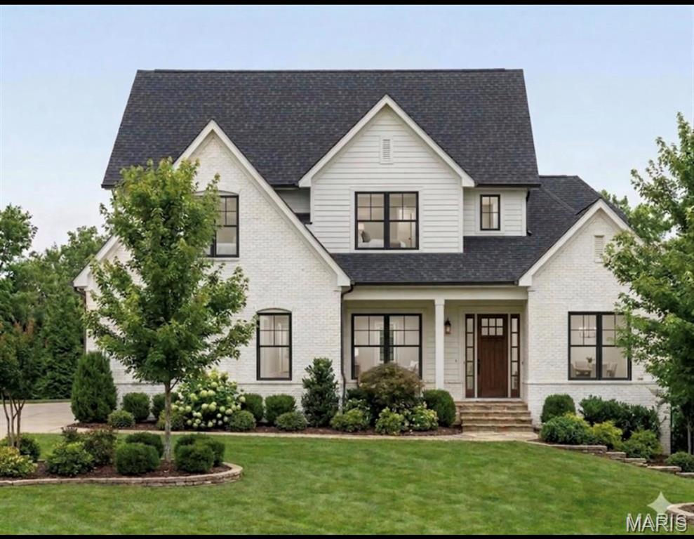 Construction is underway on another spectacular Manlin Company home. Situated on a 1/2 acre plus wooded lot in the Ladue school district.  Plenty of room for pool if you desire. Upgrades galore which includes hardwood floors, hard surface counter tops, a gas fireplace, a covered outside patio, 6 bedrooms with a main floor primary bedroom suite, and a finished lower level with a high foundation pour. Still time  for a new buyer to make their own selections on virtually everything. Call the builder/agent for details.Visit or website to see other homes built by the Manlin Company -www.themanlincompany.com