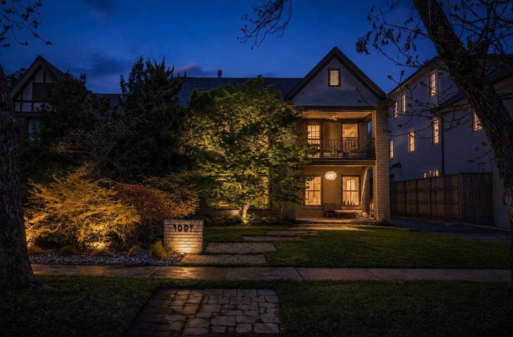 Experience a distinctive blend of architectural character and refined modern living in one of Oak Lawn’s most sought-after locations. Originally a duplex, this thoughtfully reimagined TRUE single-family residence, no shared walls home, offers a sophisticated layout designed for both entertaining & effortless daily living.The main level is filled with natural light, framed by expansive Pella windows. At the heart of the home, the formal living room is anchored by a fossil limestone-clad gas fireplace, seamlessly flowing into the dining area and a well-appointed walk-in bar complete with ice maker—ideal for hosting. A generously sized first-floor bedroom offers flexibility as a guest suite or private study.Toward the rear of the home, a secondary living area overlooks the professionally landscaped backyard and expansive deck, opening to a white marble kitchen with integrated bar-height seating. The layout is both functional and visually cohesive, designed for gathering and everyday comfort.Upstairs, a third living area that could be a library, media room, or add a wall to make a 4th bedroom, extends to a covered balcony—perfect for relaxed evenings—alongside a spacious secondary bedroom and full bath. The primary suite is notably expansive, easily accommodating a sitting area in addition to bedroom furnishings, and is complemented by marble finishes in the primary bath.The backyard is a private retreat-lush, expansive, and thoughtfully landscaped for those with an eye for design as well as function. Mature greenery, professional lighting, and curated plantings frame the generously scaled deck area for seamless indoor-outdoor entertaining, and room for a pool.4009 Prescott is positioned just minutes from Dallas’ premier dining & shopping Downtown, Uptown, Turtle Creek, Highland Park, and University Park as well as convenient access to major highways, this residence delivers a polished, urban lifestyle in one of the city’s most desirable neighborhoods.